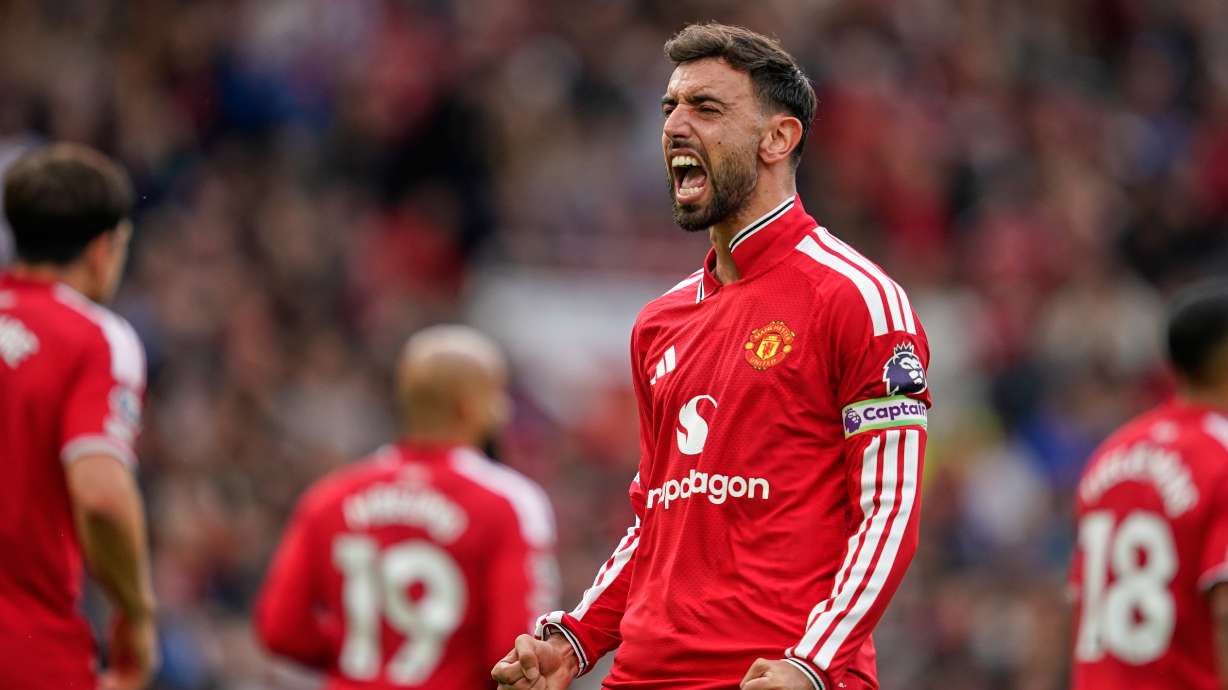 Manchester United's Bruno Fernandes celebrates after scoring his side's third goal during the English Premier League soccer match between Manchester United and Ipswich Town in Manchester, England, Sunday, Aug. 30, 2026.
