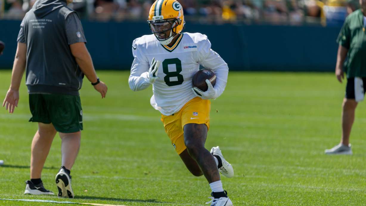 Green Bay Packers running back Josh Jacobs (8) runs with the ball during a drill at the NFL football team's training camp, Sunday, Aug. 2, 2026, in Green Bay, Wis.