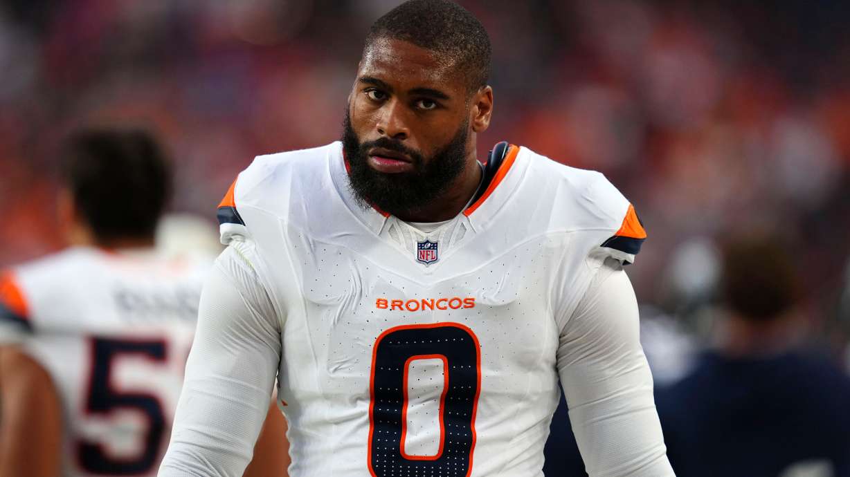 Denver Broncos linebacker Jonathon Cooper walks on the sideline during the first half of a preseason NFL football game against the Minnesota Vikings, Friday, Aug. 28, 2026, in Denver.