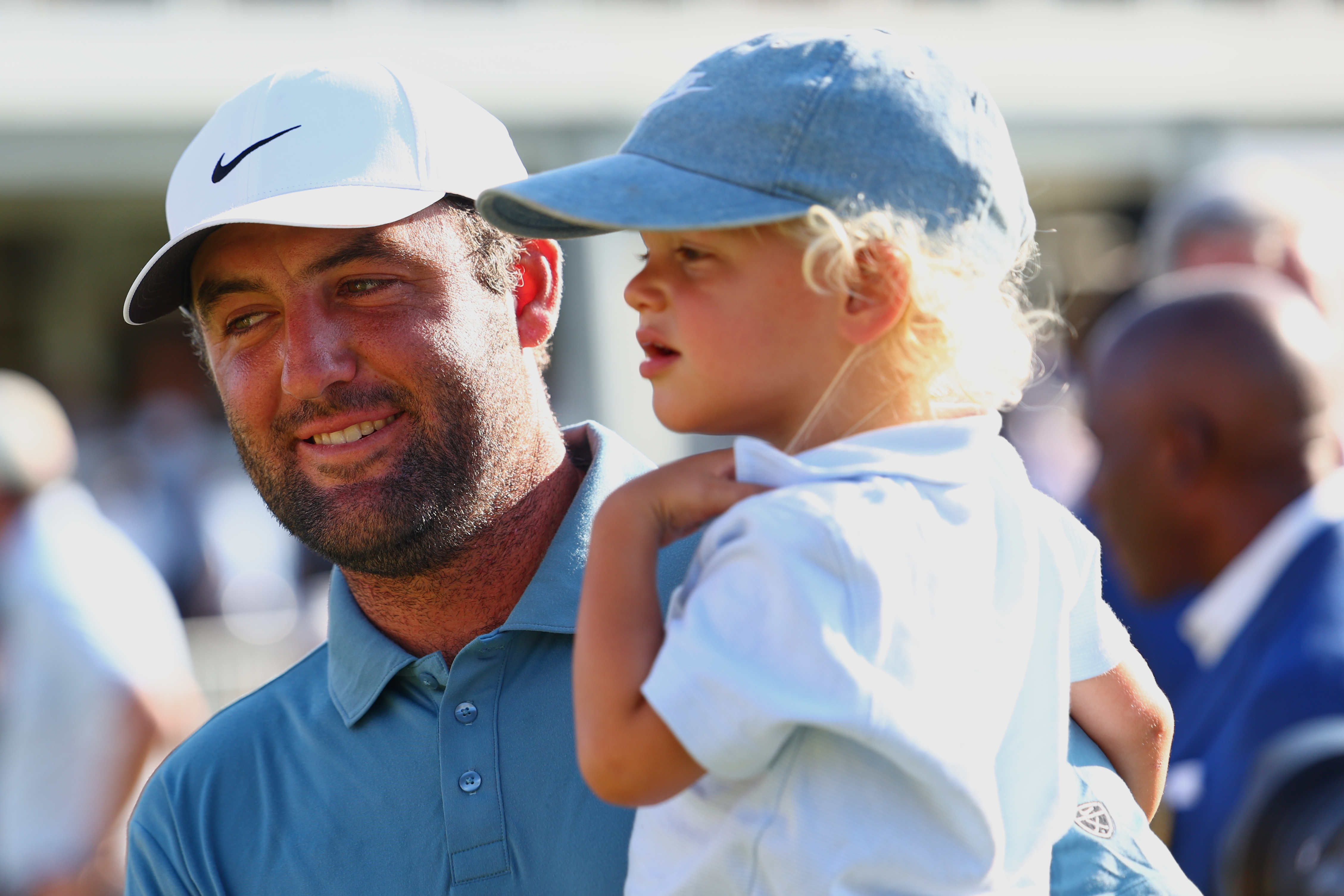 Scottie Scheffler holds his child Bennett after winning the PGA Tour Championship golf tournament Sunday, Aug. 30, 2026, in Atlanta. 