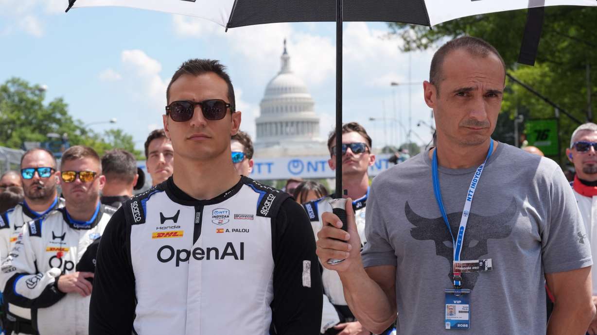 Alex Palou (10) of Spain stands during the National Anthem before the IndyCar Freedom 250 Grand Prix auto race in Washington, Sunday, Aug. 23, 2026.