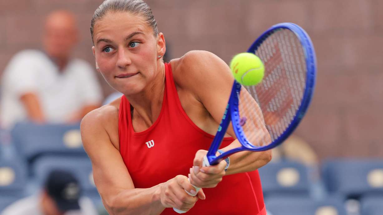 Marta Kostyuk, of Ukraine, returns the ball to Storm Hunter, of Australia, during the first round of the U.S. Open tennis championships, Sunday, Aug. 30, 2026, in New York.
