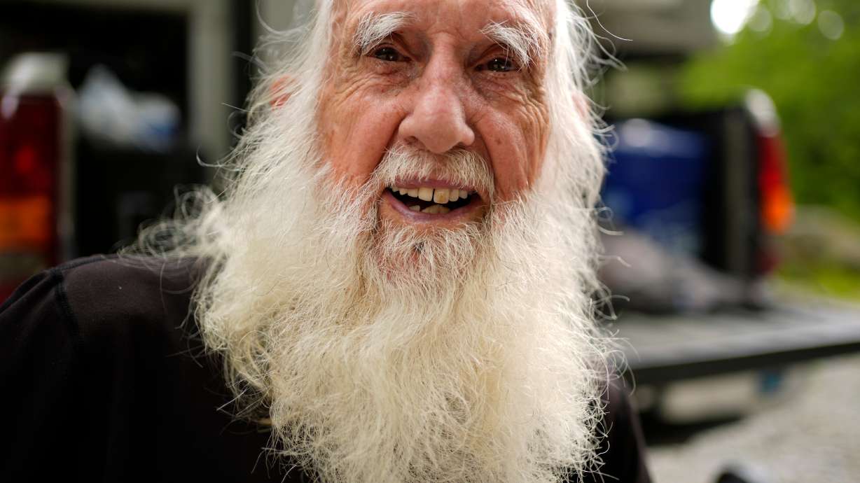 Grey Beard is a fitting trail name for 91-year-old Appalachian Trail hiker Dale Sanders, seen enjoying a rest, July 29, north of Monson, Maine.