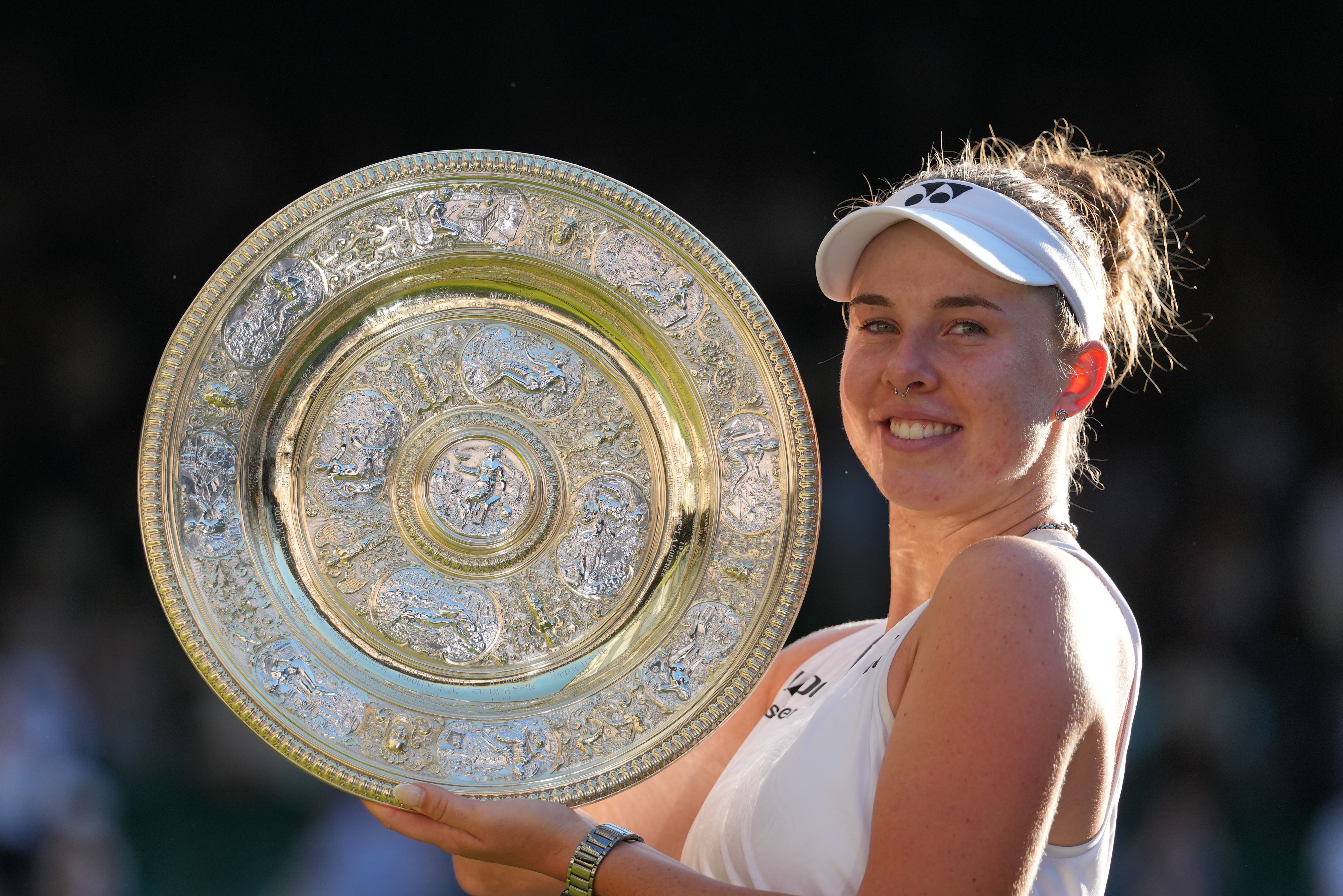 FILE - Linda Noskova of the Czech Republic poses with the trophy after winning against Karolina Muchova of the Czech Republic in the women's singles final at Wimbledon Tennis Championships in London, July 11, 2026. 