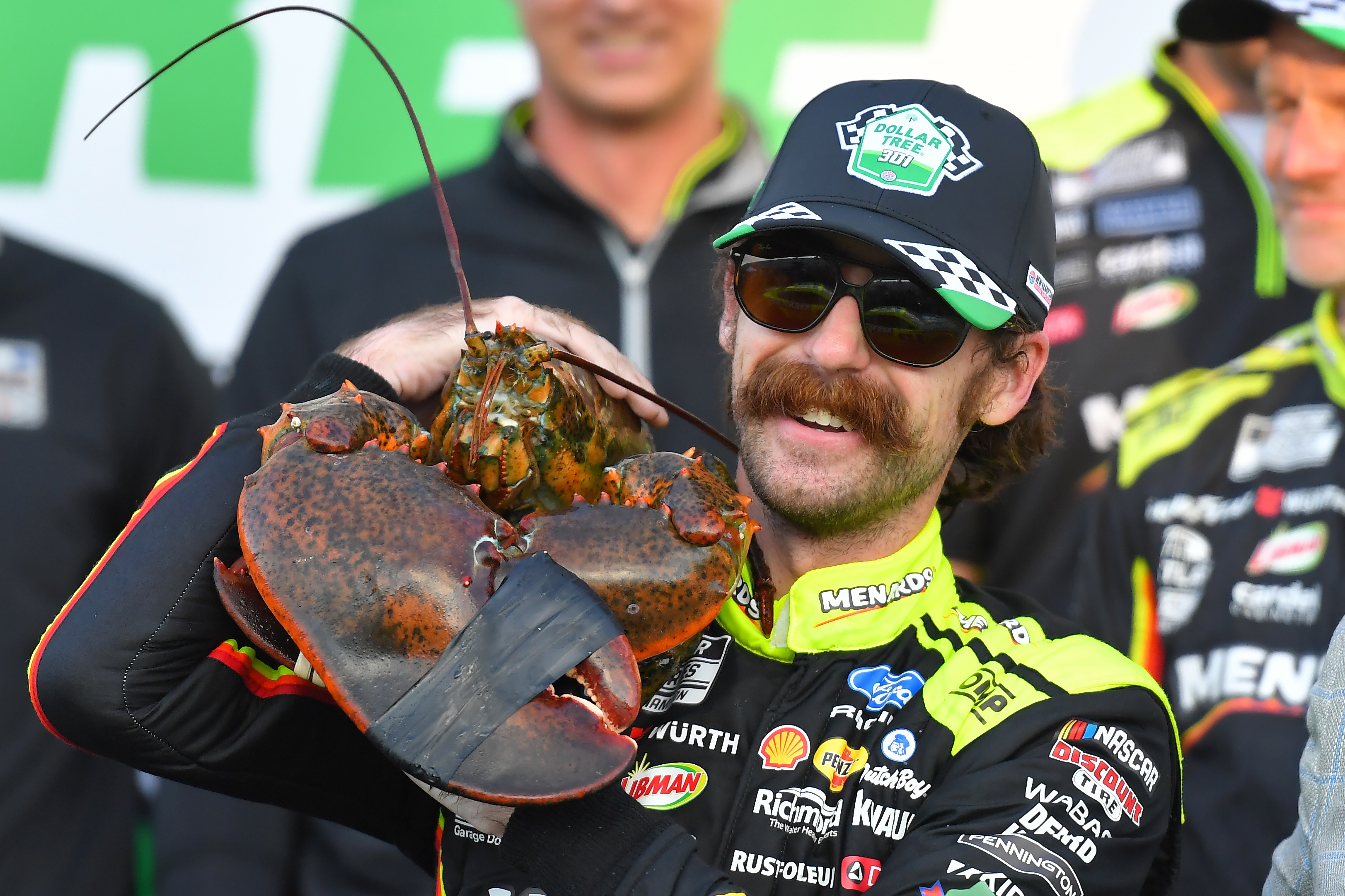 Ryan Blaney displays a lobster, a Victory Lane tradition at New Hampshire Motor Speedway, after winning a NASCAR Cup Series auto race, Sunday, Aug. 23, 2026, at the speedway in Loudon, N.H. 