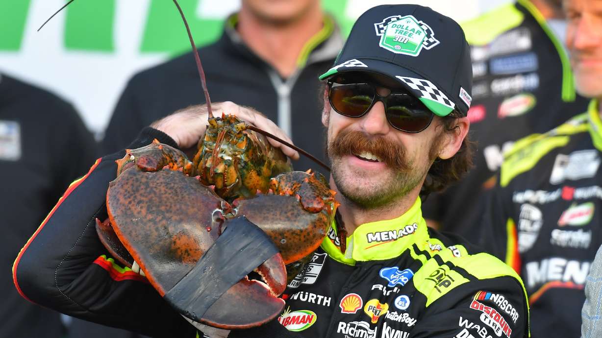 Ryan Blaney displays a lobster, a Victory Lane tradition at New Hampshire Motor Speedway, after winning a NASCAR Cup Series auto race, Sunday, Aug. 23, 2026, at the speedway in Loudon, N.H.