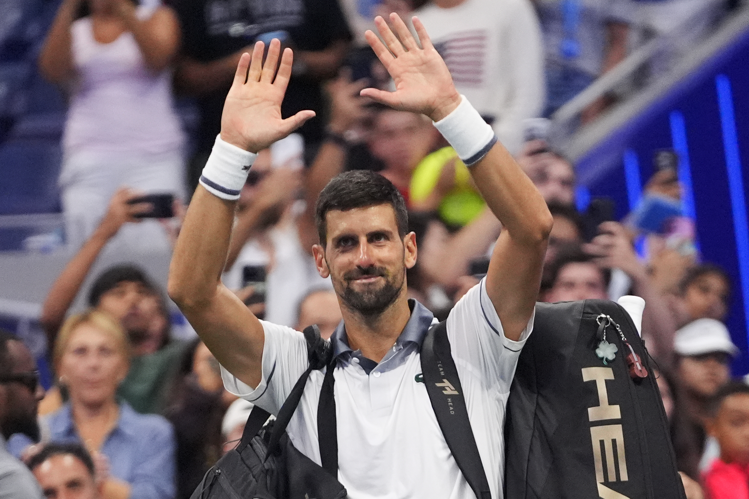 Novak Djokovic, of Serbia, gestures to the crowd after he lost to Mariano Navone, of Argentina, during the first round of the U.S. Open tennis championships Sunday, Aug. 30, 2026, in New York. 