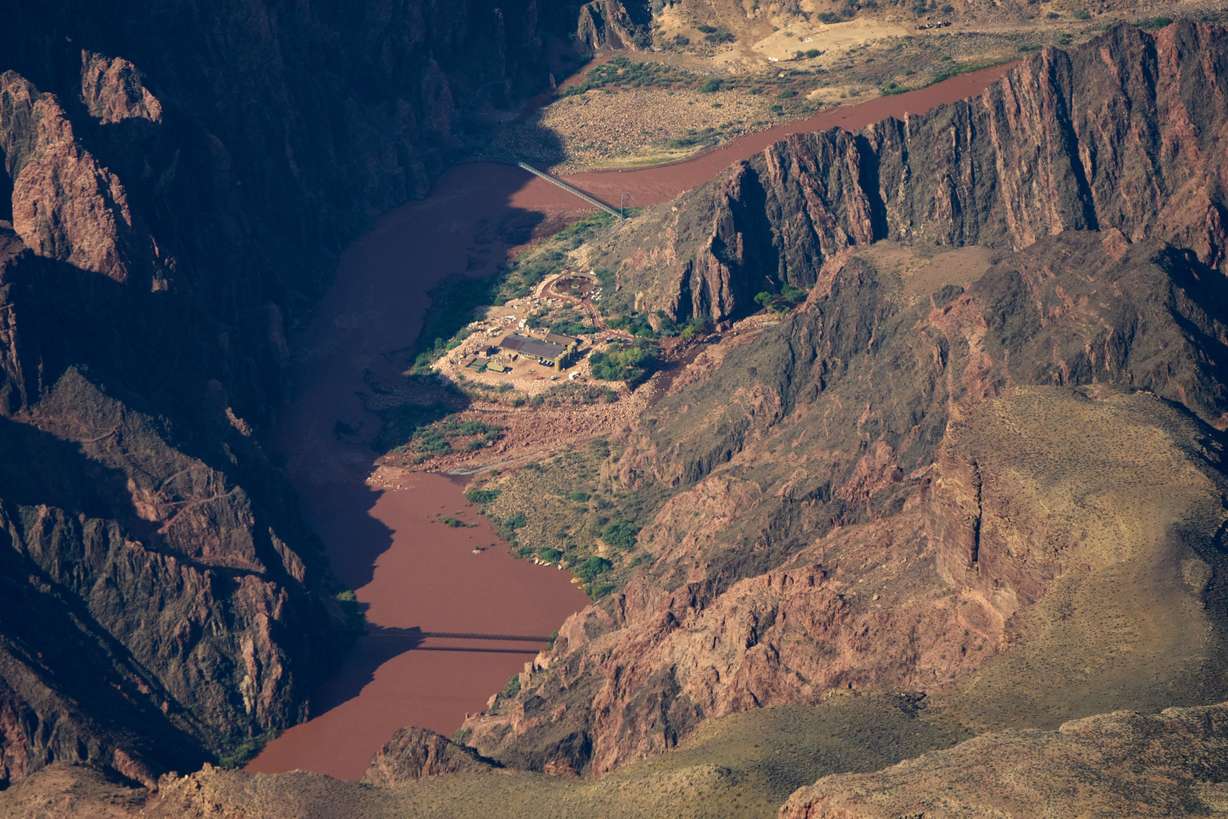 Bright Angel Canyon, the scene of flash floods, center right, merges with the Colorado River in the Grand Canyon, Monday, at Grand Canyon National Park, Ariz.