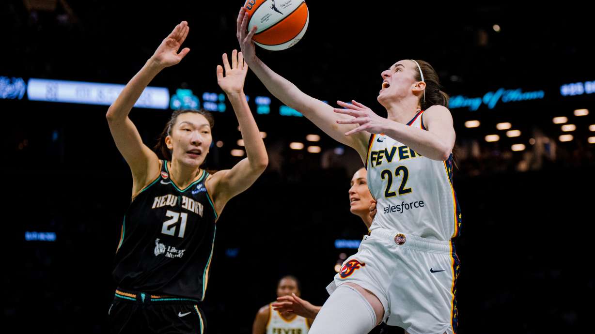 Indiana Fever guard Caitlin Clark (22) shoots a two-pointer during the second half of a WNBA basketball game against the New York Liberty, Saturday, Aug. 22, 2026, in New York.