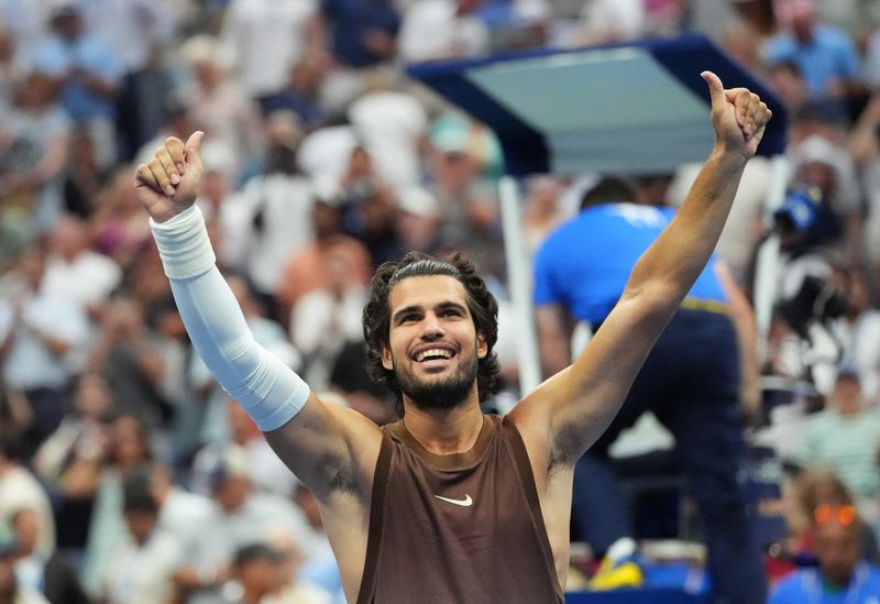 Tennis - U.S. Open - Flushing Meadows, New York, United States - August 31, 2026 Spain's Carlos Alcaraz celebrates after winning his first round match against Russia's Roman Safiullin IMAGN IMAGES via Reuters/Robert Deutsch