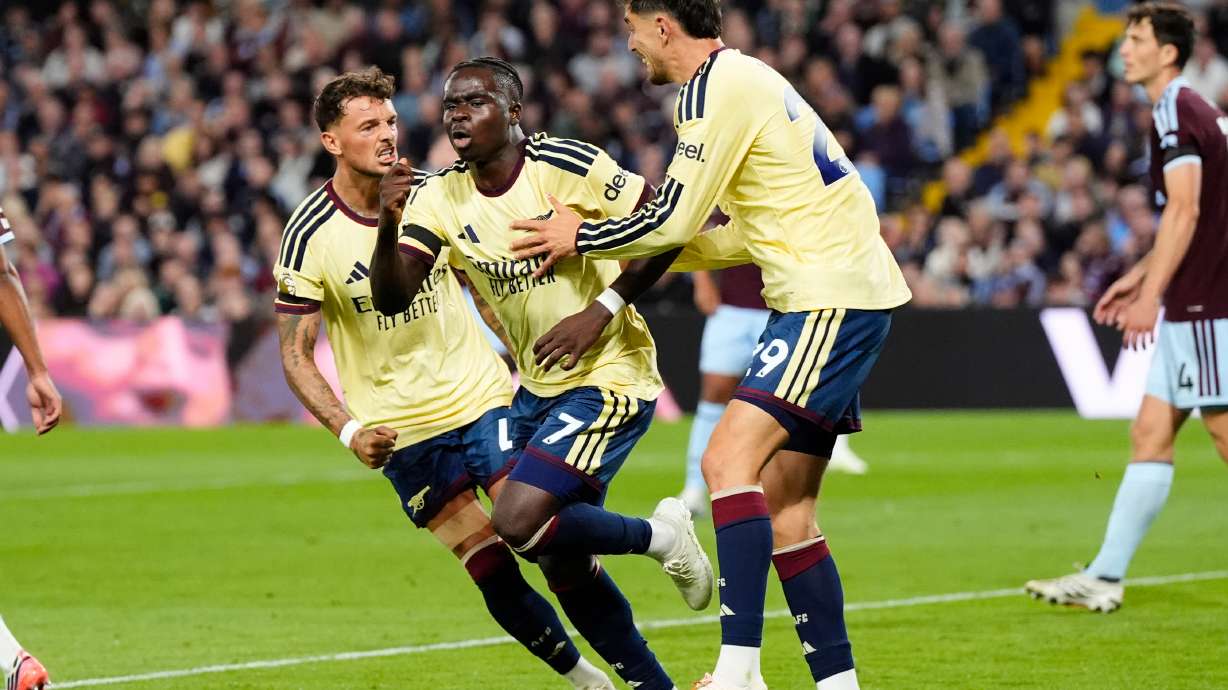 Arsenal's Bukayo Saka (7) celebrates after scoring his side's opening goal during the English Premier League soccer match between Aston Villa and Arsenal in Birmingham, England, Monday, Aug. 31, 2026.