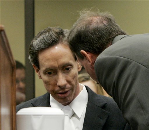 Warren Jeffs, the self-proclaimed prophet of a polygamist sect, talks with attorney Walter Bugden, right, in court Wednesday, Sept. 27, 2006, in St. George, Utah. (AP Photo/Douglas C. Pizac, Pool)