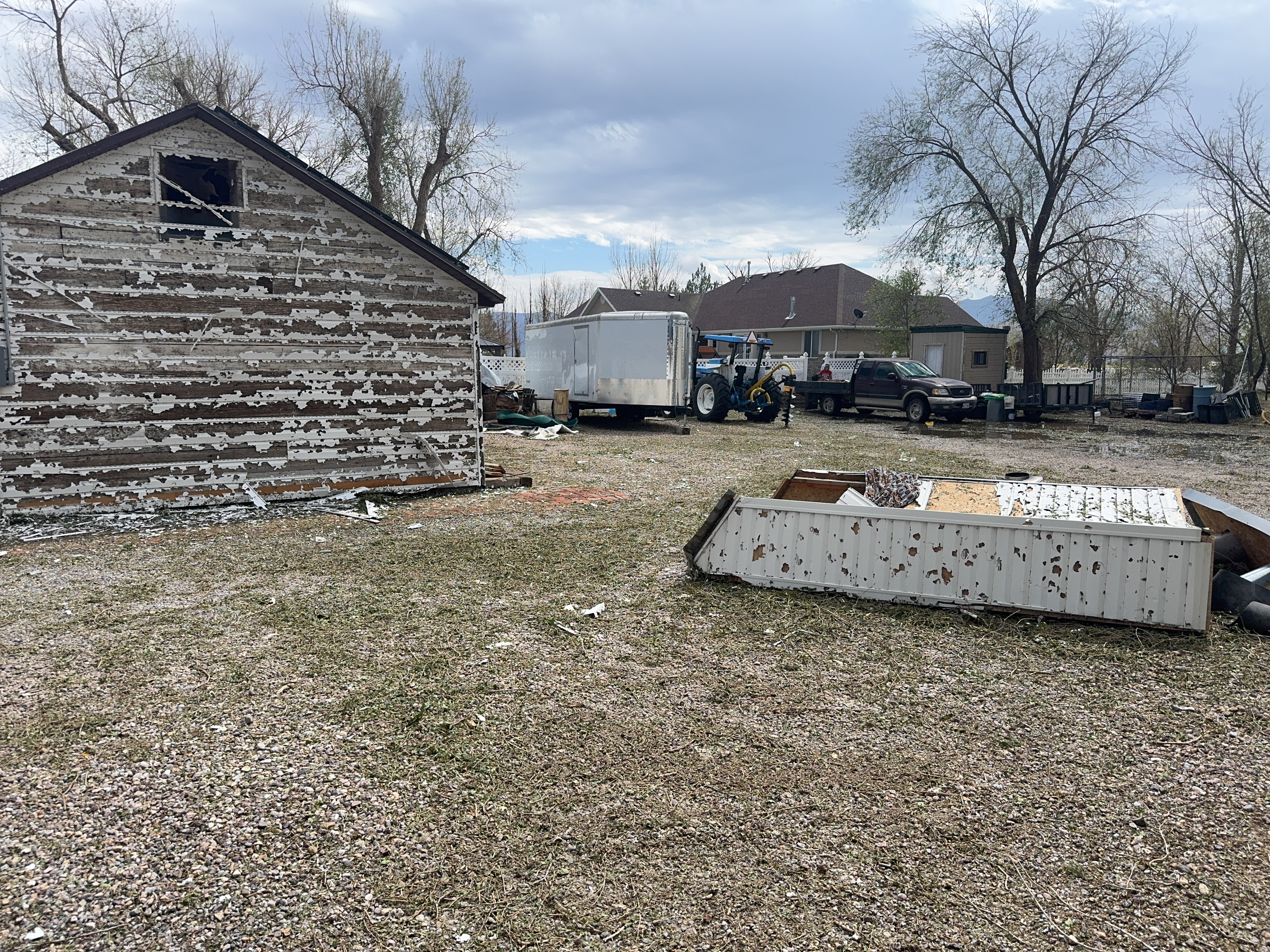 Damage to a home's siding from hail and wind in Millard County on Saturday.