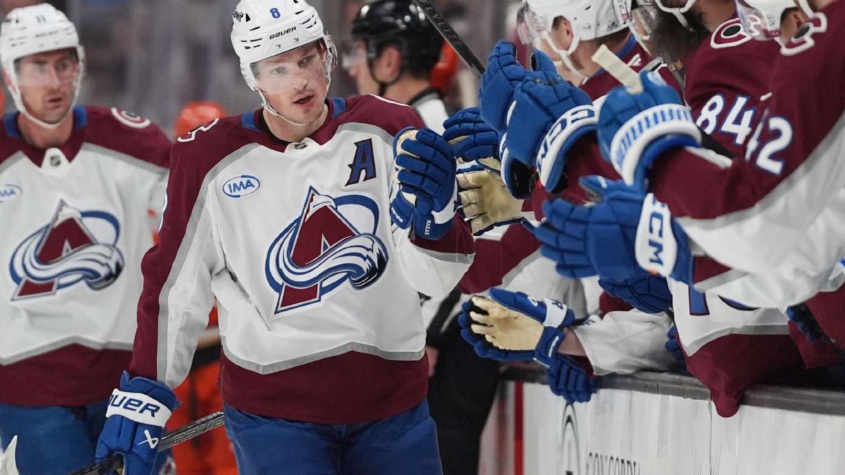 FILE - Colorado Avalanche defenseman Cale Makar, center, celebrates his goal with teammates during the first period of an NHL hockey game against the Anaheim Ducks, March 3, 2026, in Anaheim, Calif.