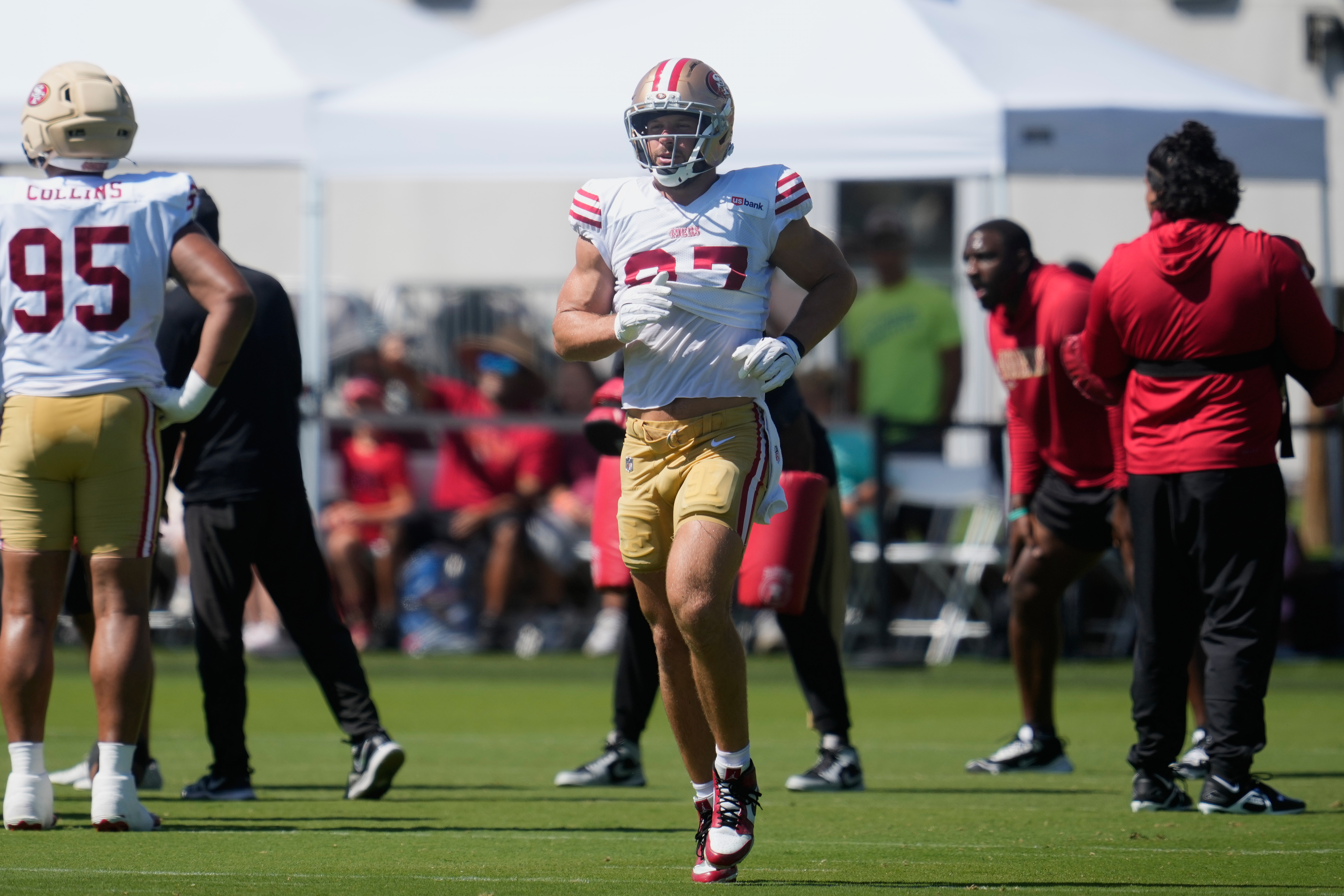 San Francisco 49ers defensive end Nick Bosa jogs on the field during the NFL football team's training camp, Monday, Aug. 3, 2026, in Santa Clara, Calif. 