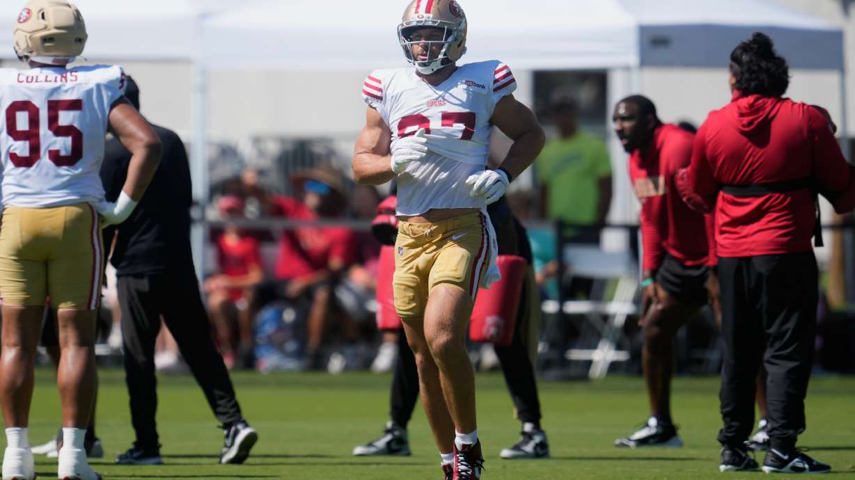 San Francisco 49ers defensive end Nick Bosa jogs on the field during the NFL football team's training camp, Monday, Aug. 3, 2026, in Santa Clara, Calif.
