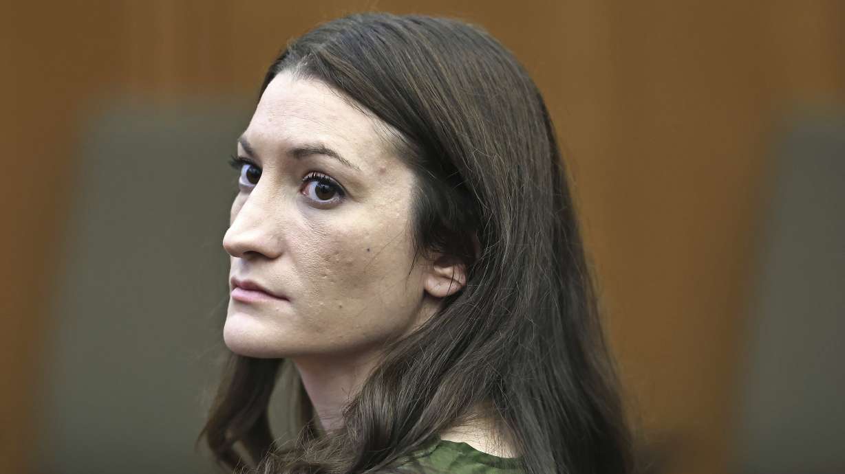 Lindsay Clancy watches jury members as Judge William Sullivan polls them before they start deliberations during her murder trial at Plymouth Superior Court in Plymouth, Mass., Monday. The jury entered a fourth day of deliberations on Tuesday.