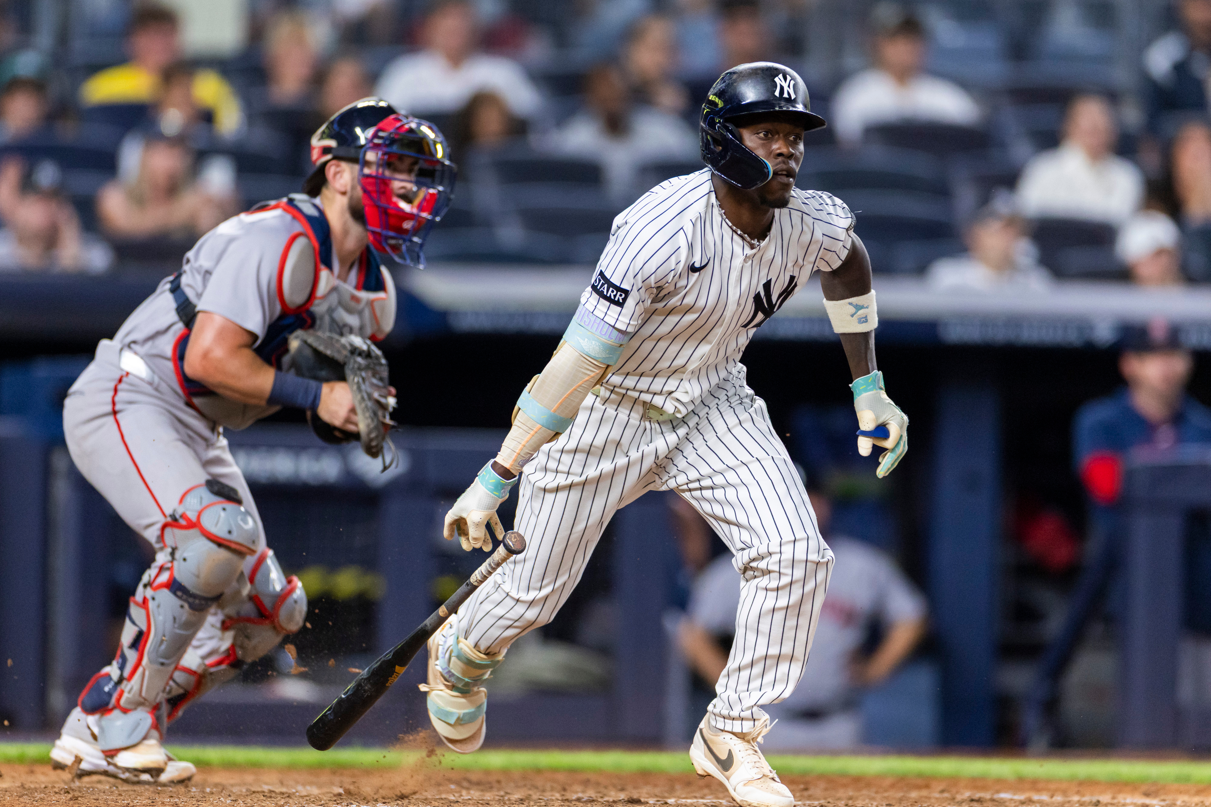 New York Yankees' Jazz Chisholm Jr., right, watches after he hit into a fielder's choice in the eighth inning during the second baseball game of a doubleheader against the Boston Red Sox, Saturday, Aug. 29, 2026, in New York. 
