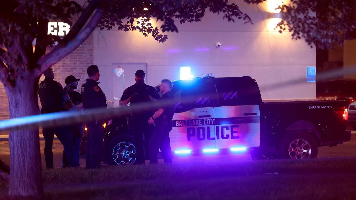 Police work at the scene of a shooting involving police near 600 East and 400 South in Salt Lake City on Monday. A man believed to have been holding a knife was shot by police but is expected to survive.