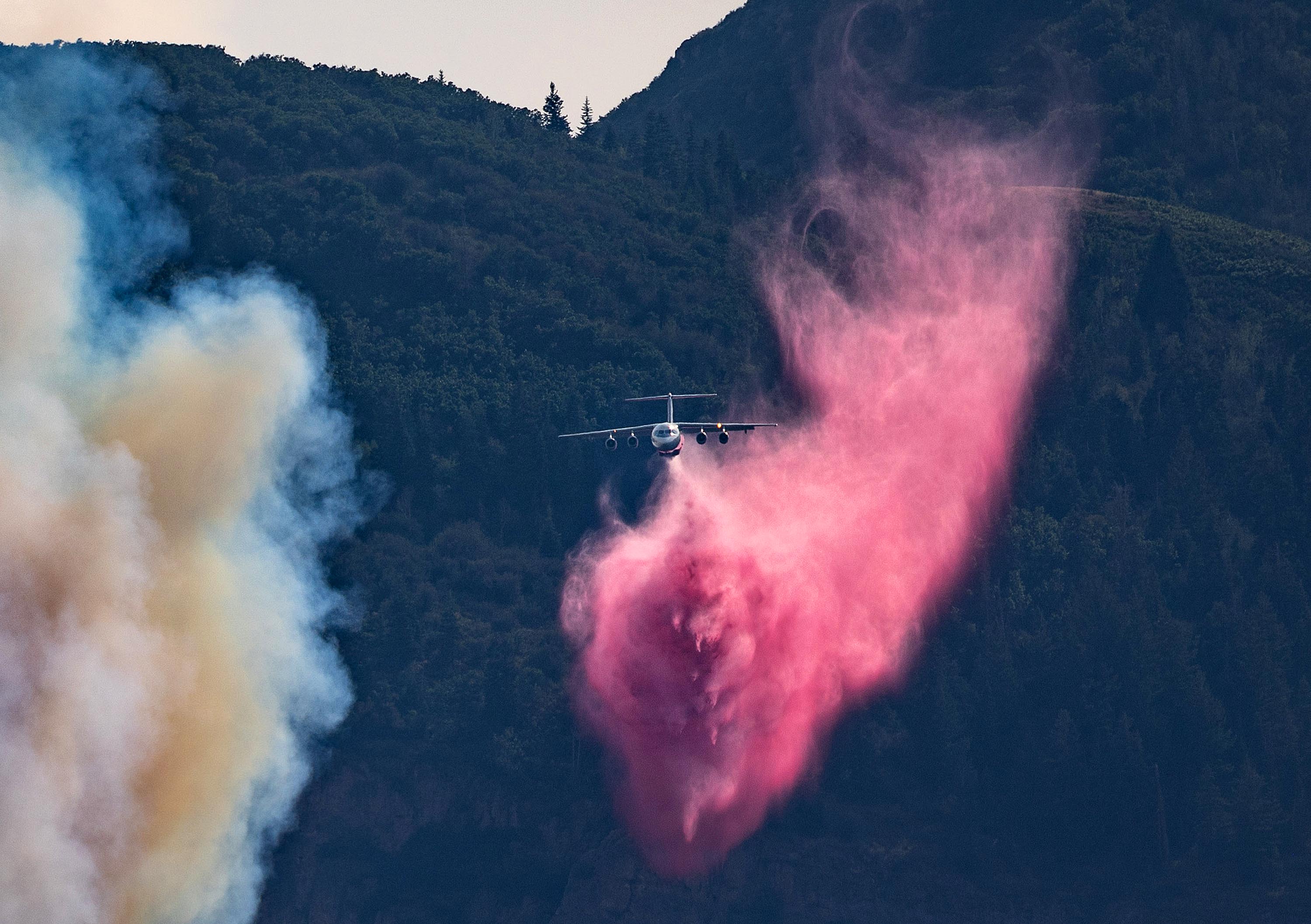 Firefighters release fire retardant on a wildfire in Rocky Canyon near Henefer, Summit County, on Aug. 10. Utah has been in an endless water crisis cycle of fires, floods and drought.