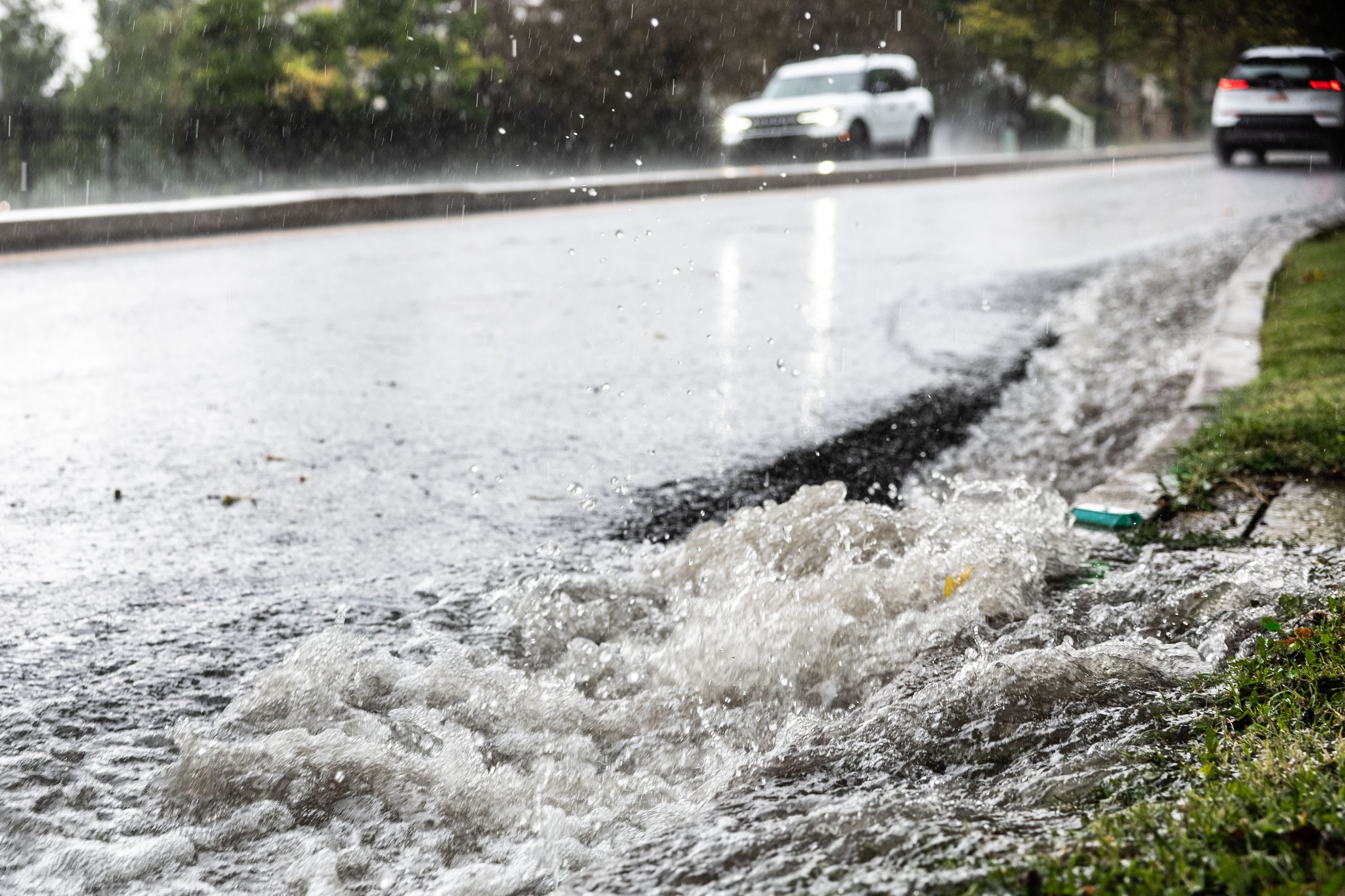 Water rushes down State Street during a heavy rainstorm in Salt Lake City on Aug. 14. The recent heavy rains have not had much impact on the state's drought so far.