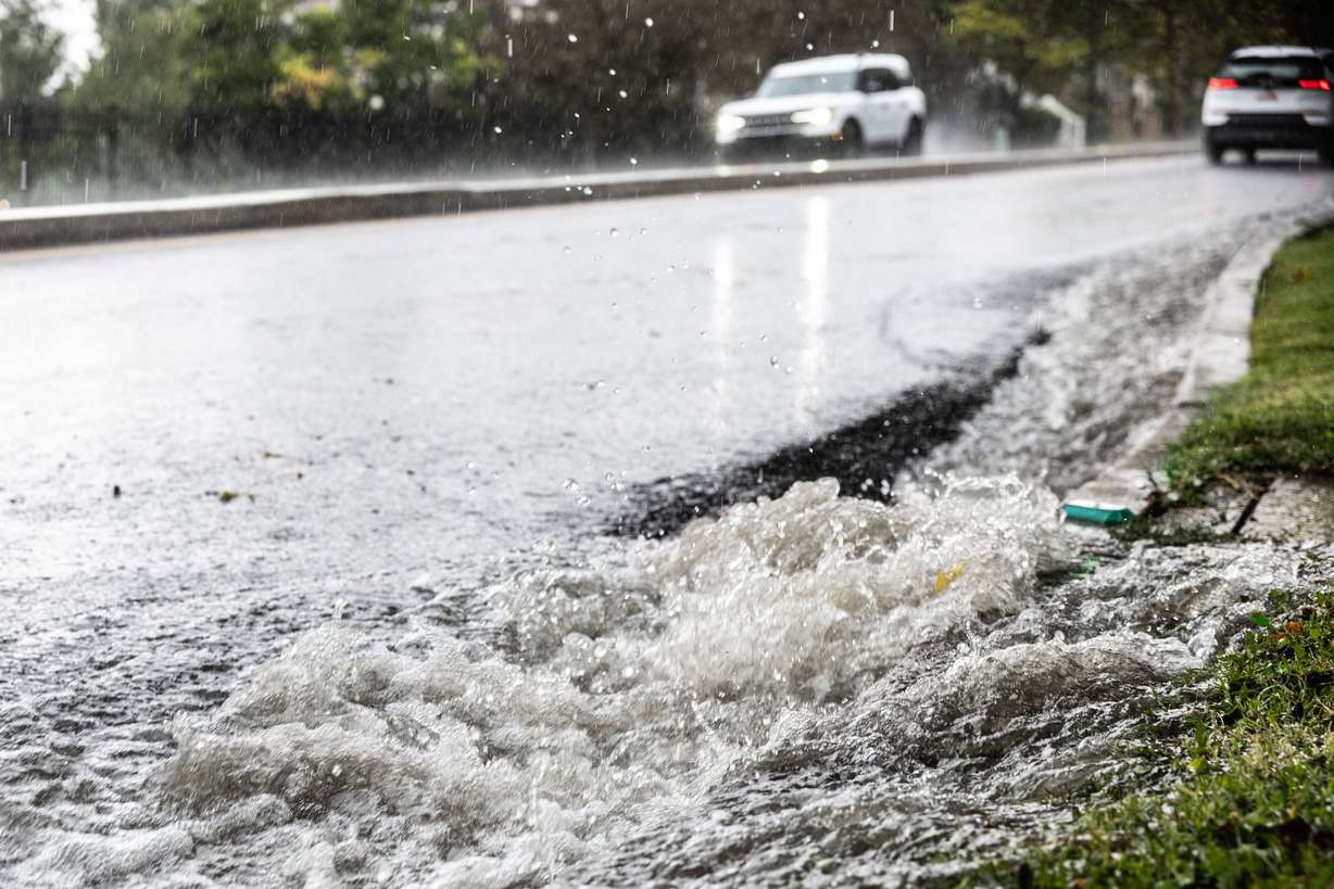 Water rushes down State Street during a heavy rainstorm in Salt Lake City on Aug. 14. The recent heavy rains have not had much impact on the state's drought so far.