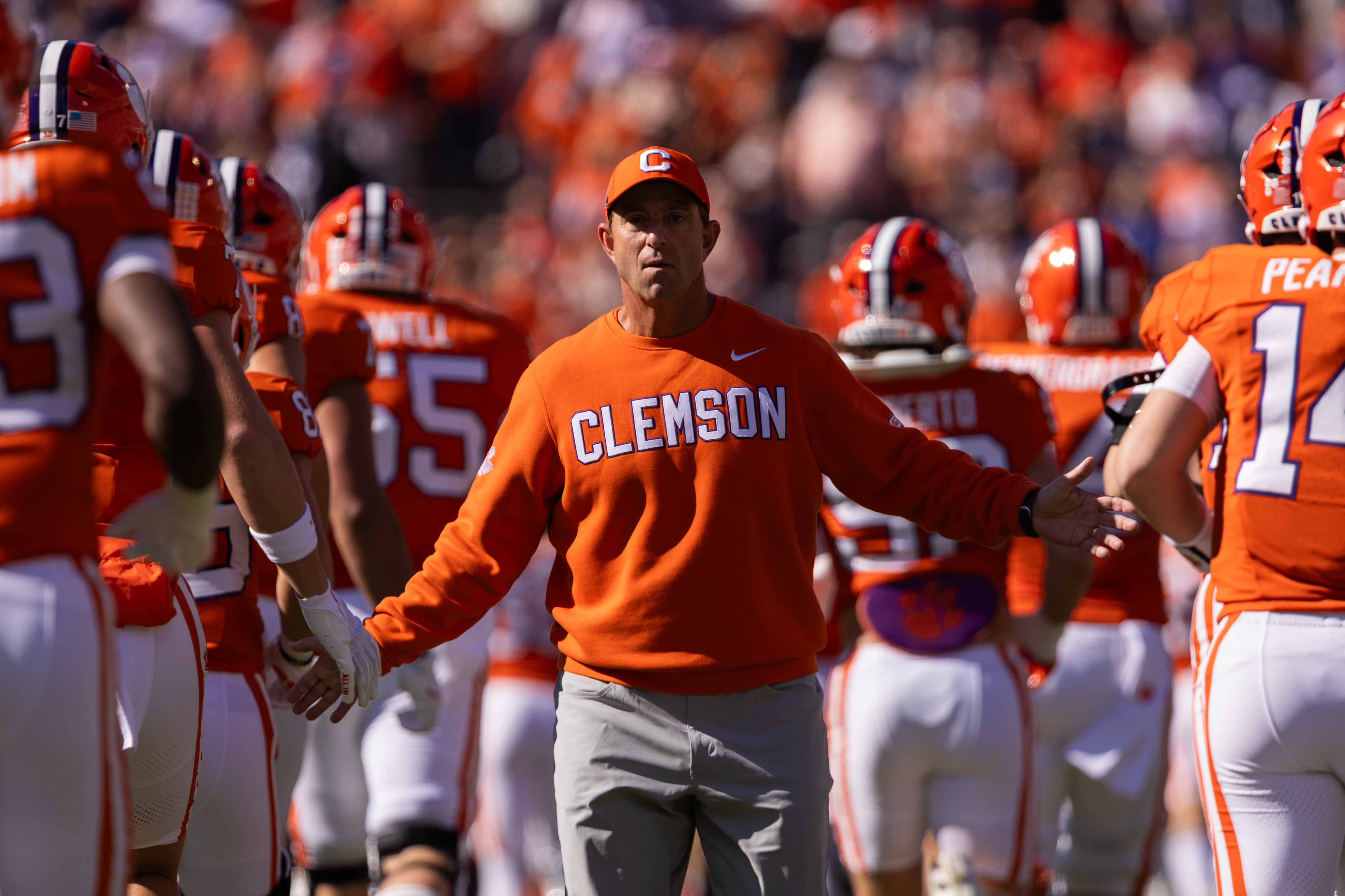 FILE - Clemson head coach Dabo Swinney greets his team before an NCAA college football game against Duke, Nov. 1, 2025, in Clemson, S.C. 