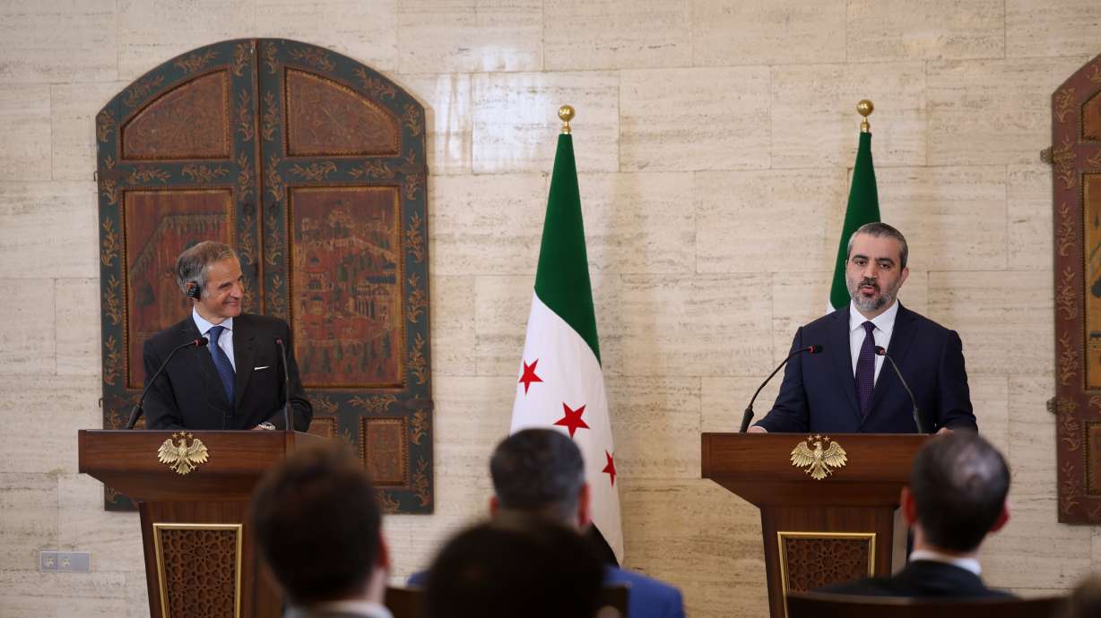 International Atomic Energy Agency's director-general Rafael Mariano Grossi, left, and Syrian Foreign Minister Asaad al-Shibani attend a press conference in Damascus, Syria, Aug. 18.