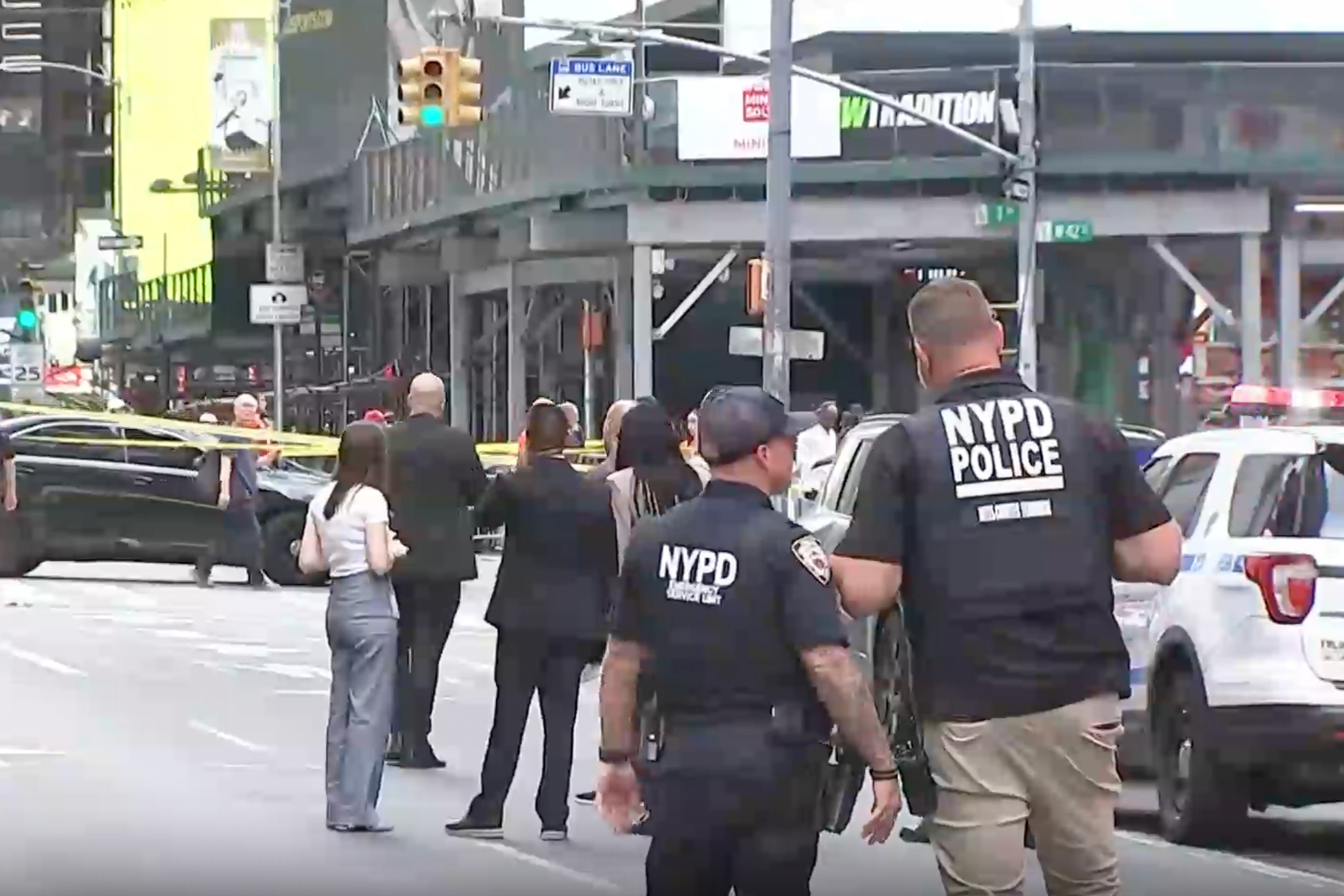 This image made from video provided by WABC shows NYPD officers on the scene after a woman brandishing two large knives was shot by officers in Times Square in New York, Monday, Aug. 31, 2026. 