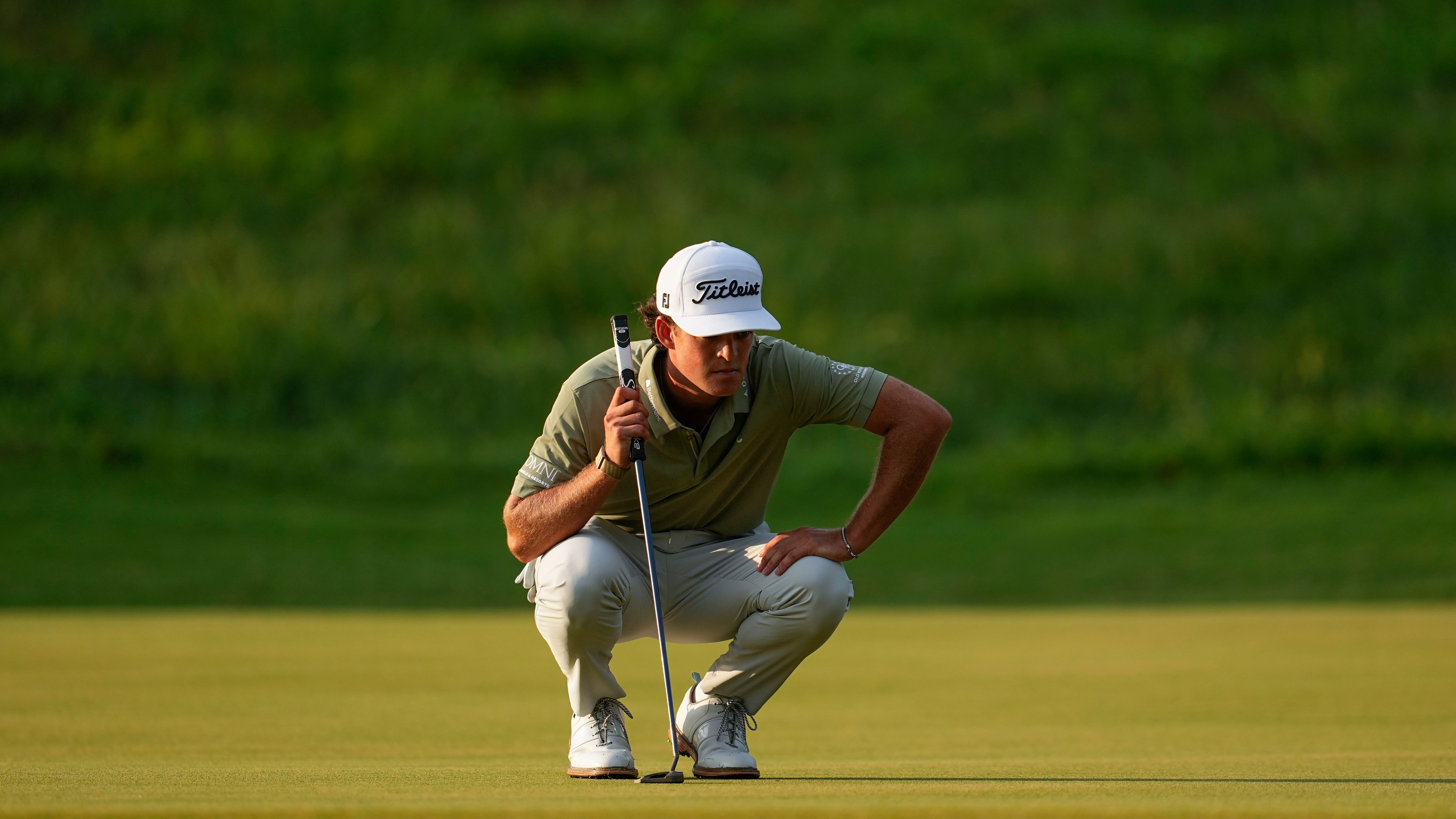 Jackson Koivun lines up his ball on the first green during the first round of the St. Jude Championship golf tournament, Thursday, Aug. 13, 2026, in Memphis, Tenn. 