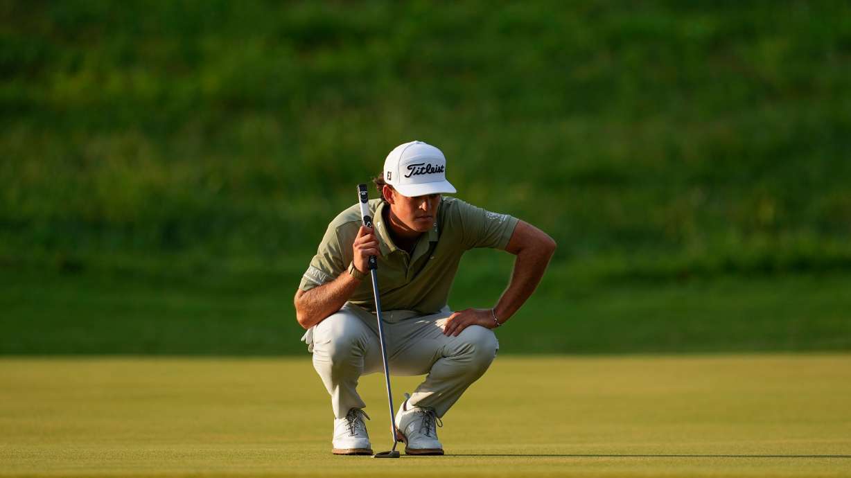 Jackson Koivun lines up his ball on the first green during the first round of the St. Jude Championship golf tournament, Thursday, Aug. 13, 2026, in Memphis, Tenn.