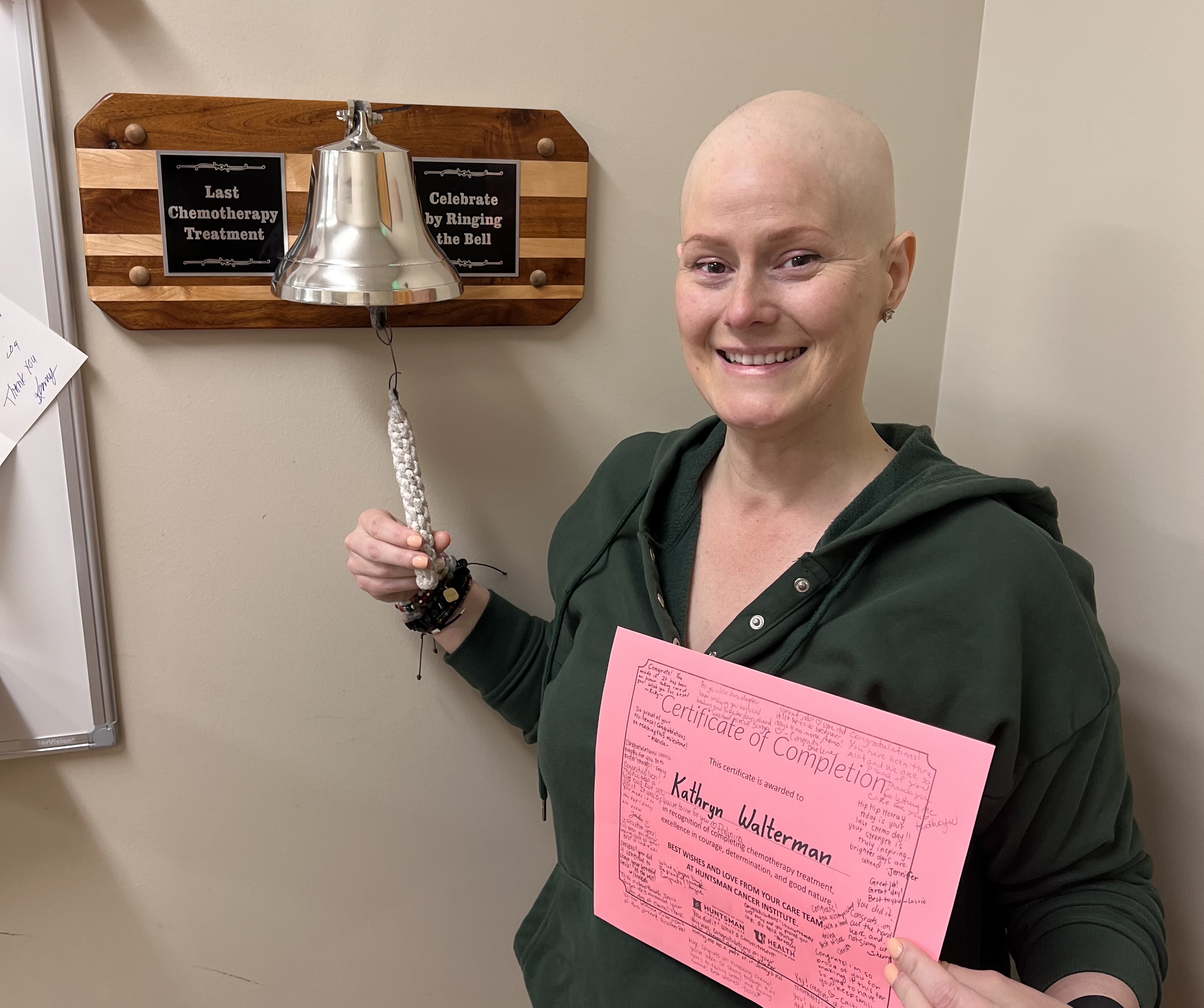 Katie Walterman rings the bell to celebrate finishing chemotherapy at Huntsman Cancer Institute.