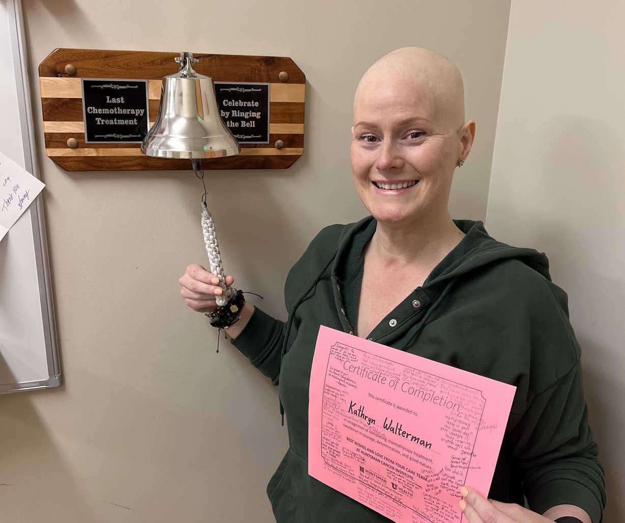Katie Walterman rings the bell to celebrate finishing chemotherapy at Huntsman Cancer Institute.