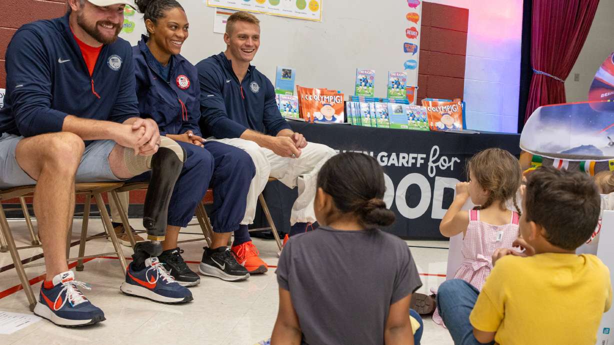 Paralympian Joe Pleban, left, and Olympic bobsledders Kaysha Love and Hunter Powell enjoy sharing their experiences with Backman Elementary students at the the Celebrate Utah 2034 "Opening Ceremonies" on Tuesday.