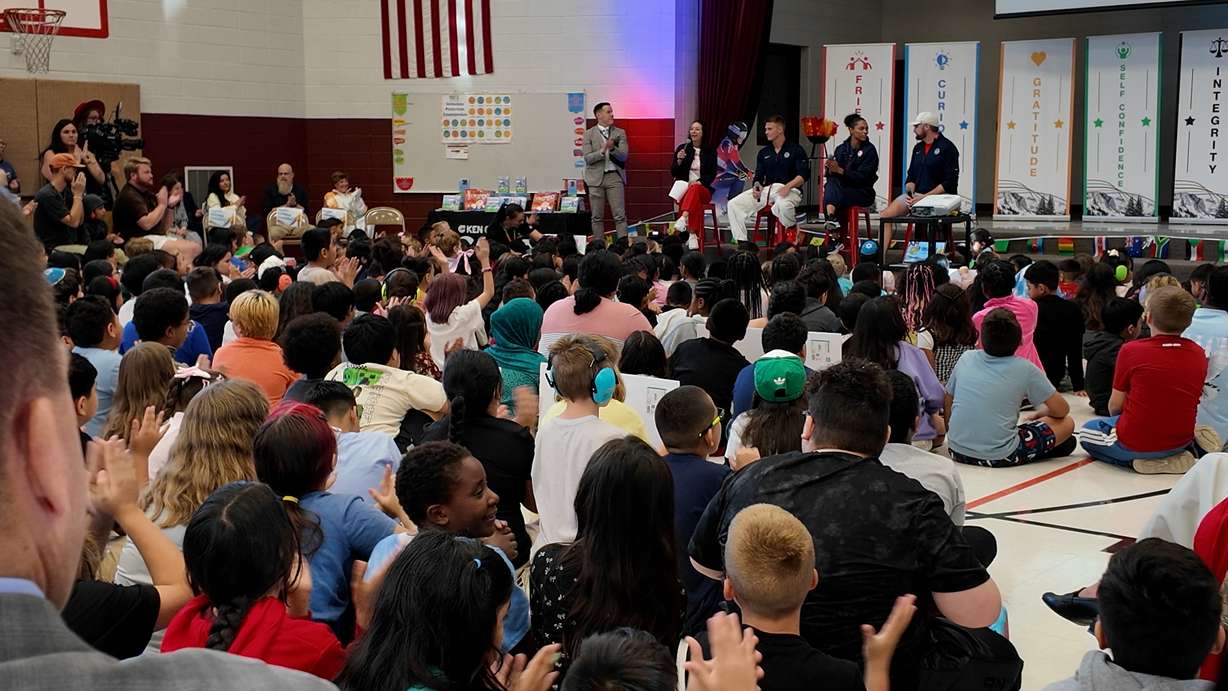 Left to right: Olympic bobsledders Hunter Powell and Kaysha Love, and Paralympic Snowboarder answer questions in a panel at Backman Elementary.