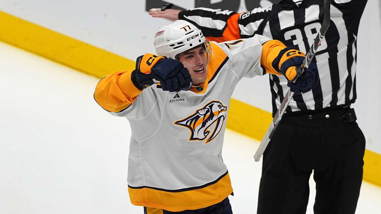 FILE - Nashville Predators right wing Luke Evangelista (77) celebrates after scoring a goal in the first period of an NHL hockey game, on Nov. 11, 2024, in Denver.
