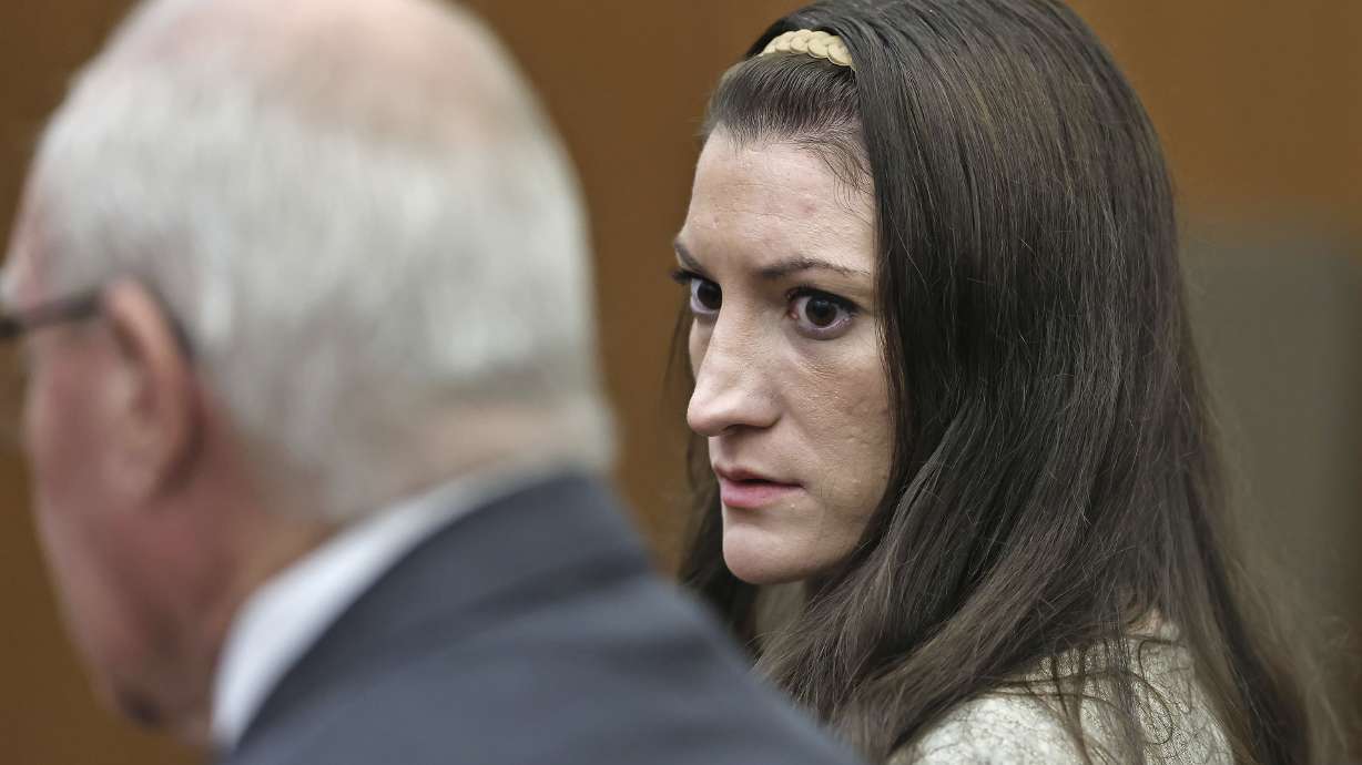Lindsay Clancy looks to her lawyer, Kevin Reddington, as the jury keeps deliberating at her murder trial at Plymouth Superior Court in Plymouth, Mass., Tuesday. Jurors were set to resume deliberations on Wednesday.
