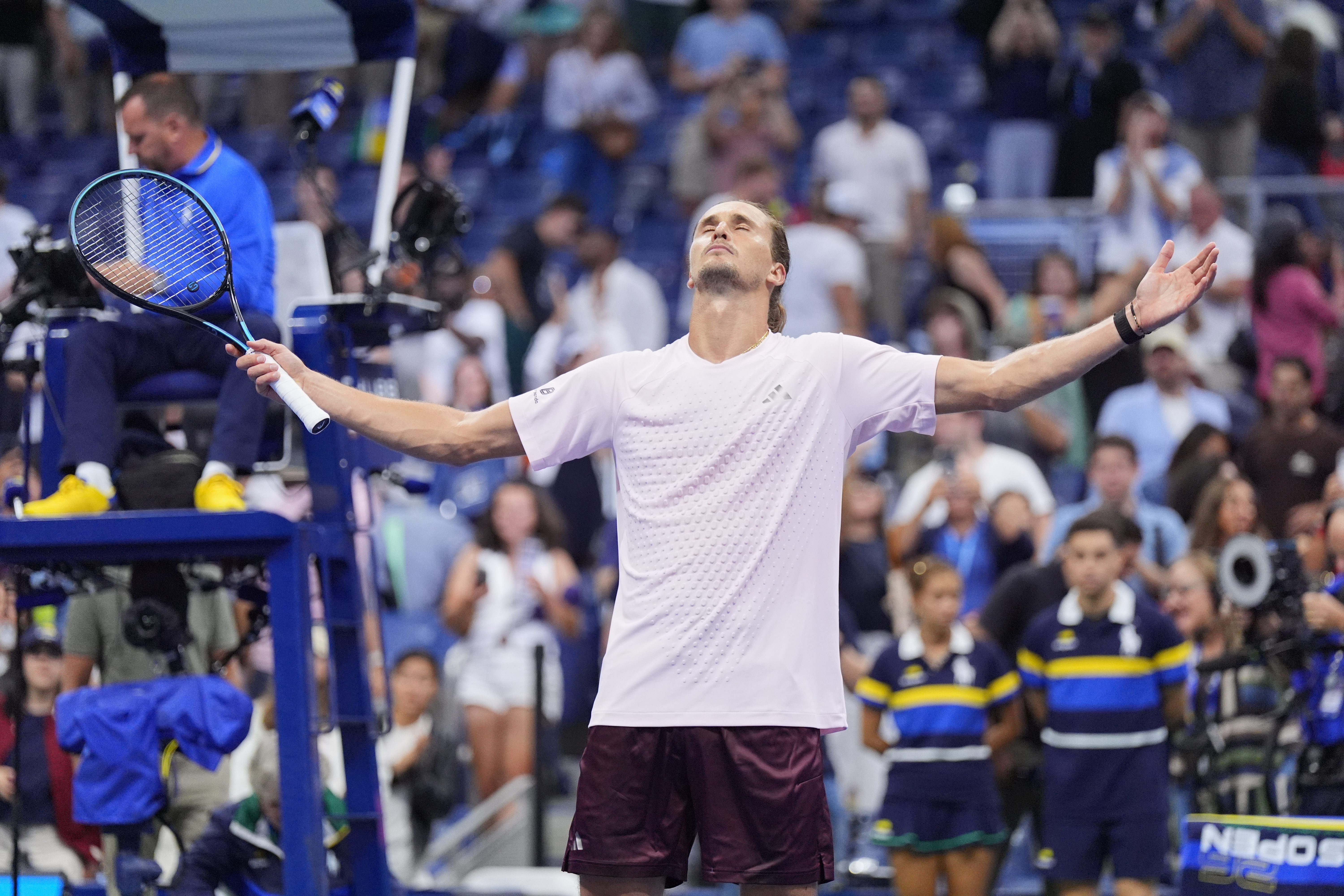 Alexander Zverev, of Germany, celebrates defeating Lorenzo Sonego, of Italy, in five sets In the first round of the U.S. Open tennis championships early Wednesday, Sept. 2, 2026, in New York. 