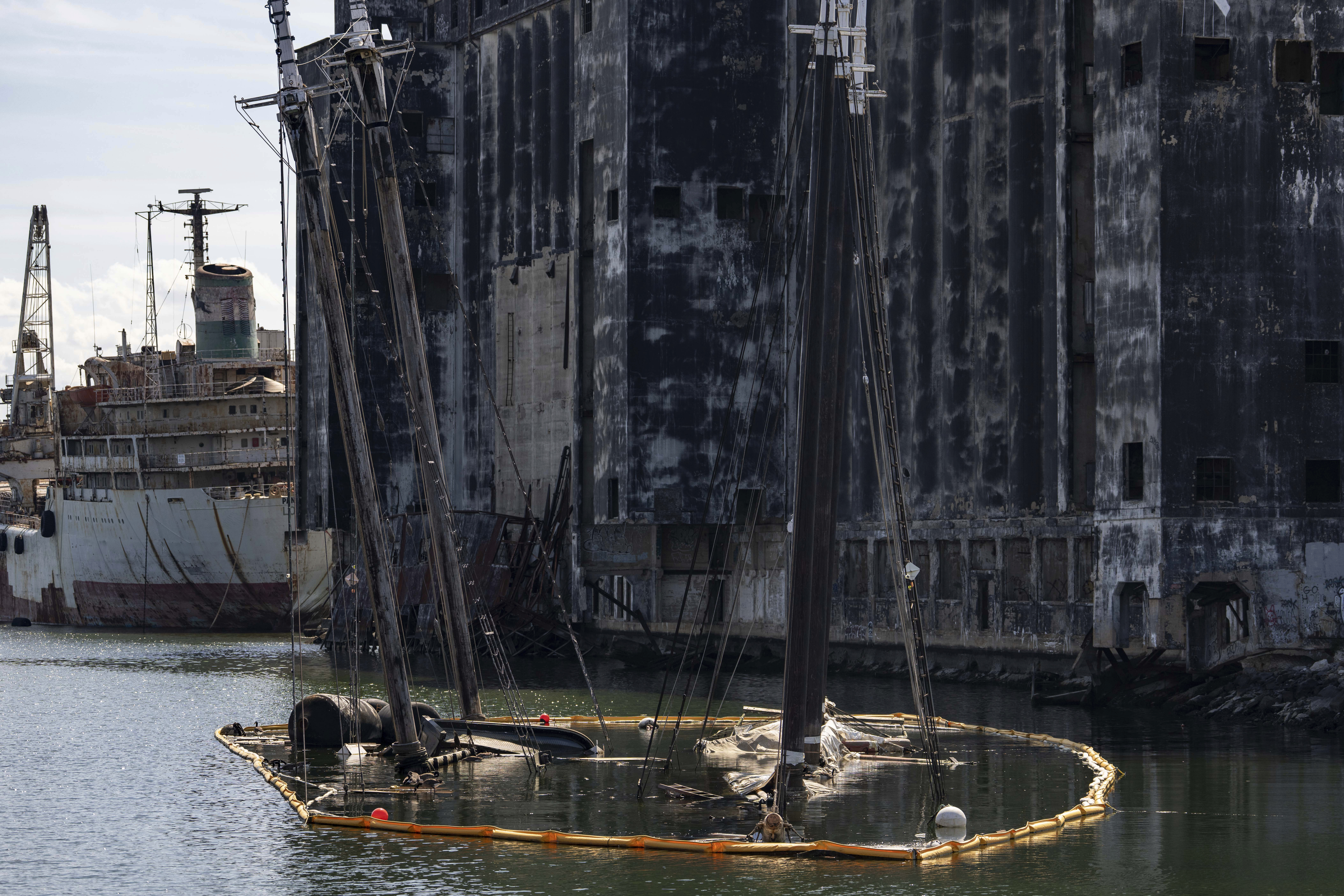 Debris of the Victory Chimes and the Pilot floats in the Henry Street Basin, Wednesday, Aug. 26, 2026, in the Brooklyn borough of New York. 