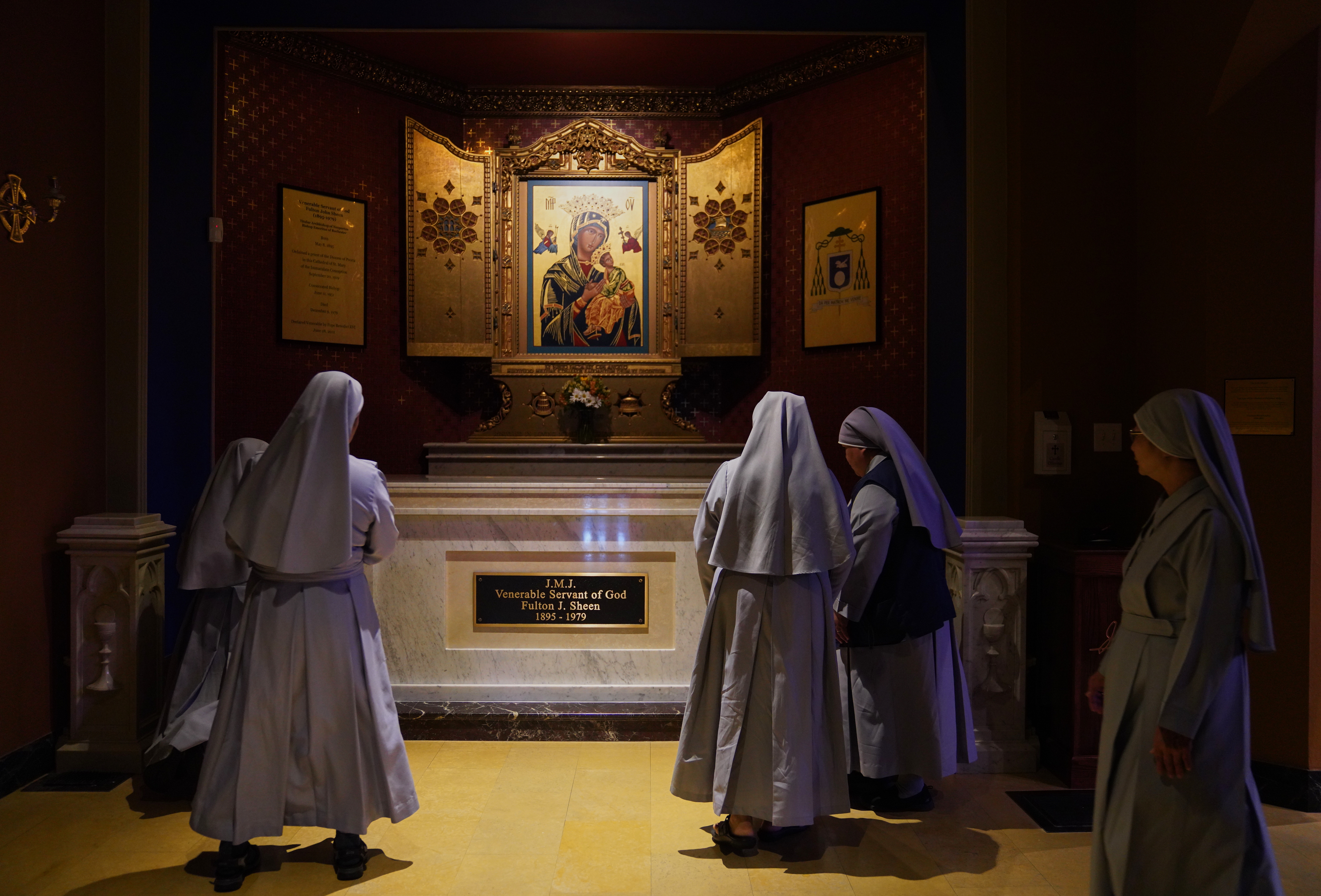 Nuns pray at the tomb of Archbishop Fulton Sheen at the Cathedral of St. Mary of the Immaculate Conception in Peoria, Ill., on July 15, 2026. 