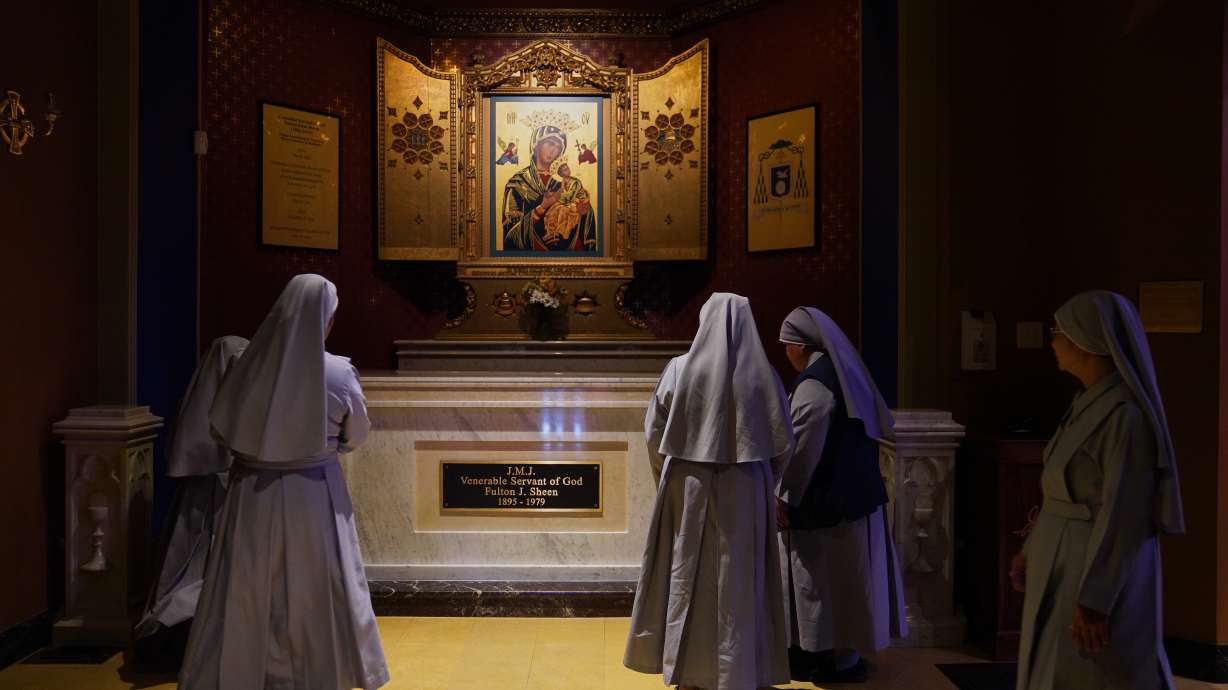 Nuns pray at the tomb of Archbishop Fulton Sheen at the Cathedral of St. Mary of the Immaculate Conception in Peoria, Ill., on July 15, 2026.