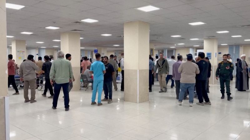 People wait at a hospital lobby following an attack at a wedding near Sirik, a coastal area on the Strait of Hormuz, the Iranian Red Crescent reported, as the United States and Iran engaged in the most significant exchange of fire in weeks, in Sirik, Hormozgan province, Iran, Wednesday. The father of the bride said he was relieved the injuries weren't worse.