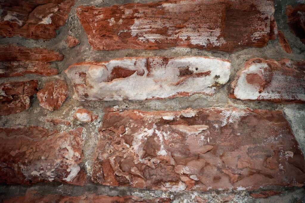 Salt and mineral deposits from seeping water can been seen and felt on the historic sandstone walls of the Episcopal Cathedral Church of St. Mark in Salt Lake City on Tuesday.