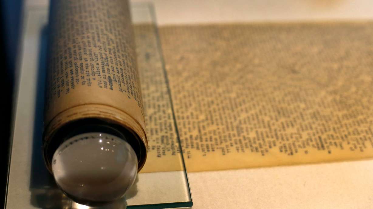 FILE - Jack Kerouac's "On the Road" and its working manuscript, the extraordinary 120-foot scroll he would unfurl before startled publishers, sits on display at the American Writers Museum in Chicago, May 8, 2017.