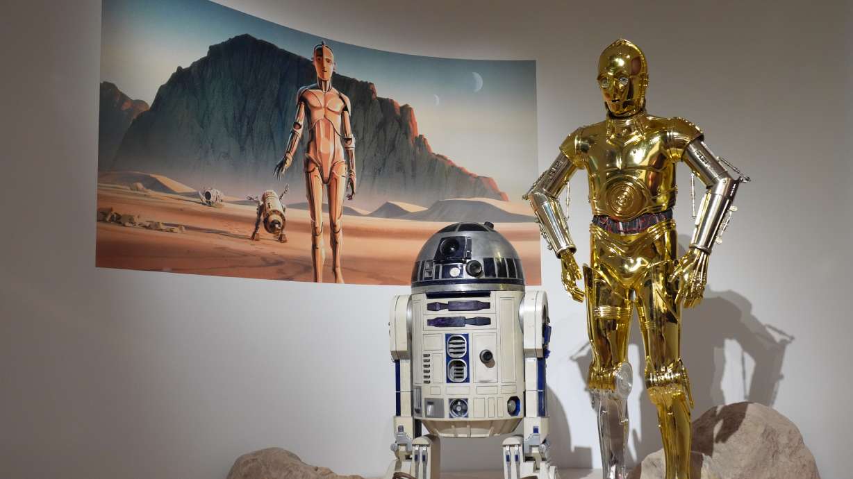 Production designer Norman Reynolds' robot R2-D2, left, and John Mollo's costume for the C-3PO character from the "Star Wars" franchise are displayed in the Cinema Gallery during a preview of the Lucas Museum of Narrative Art on Monday, Aug. 31, 2026, in Los Angeles.