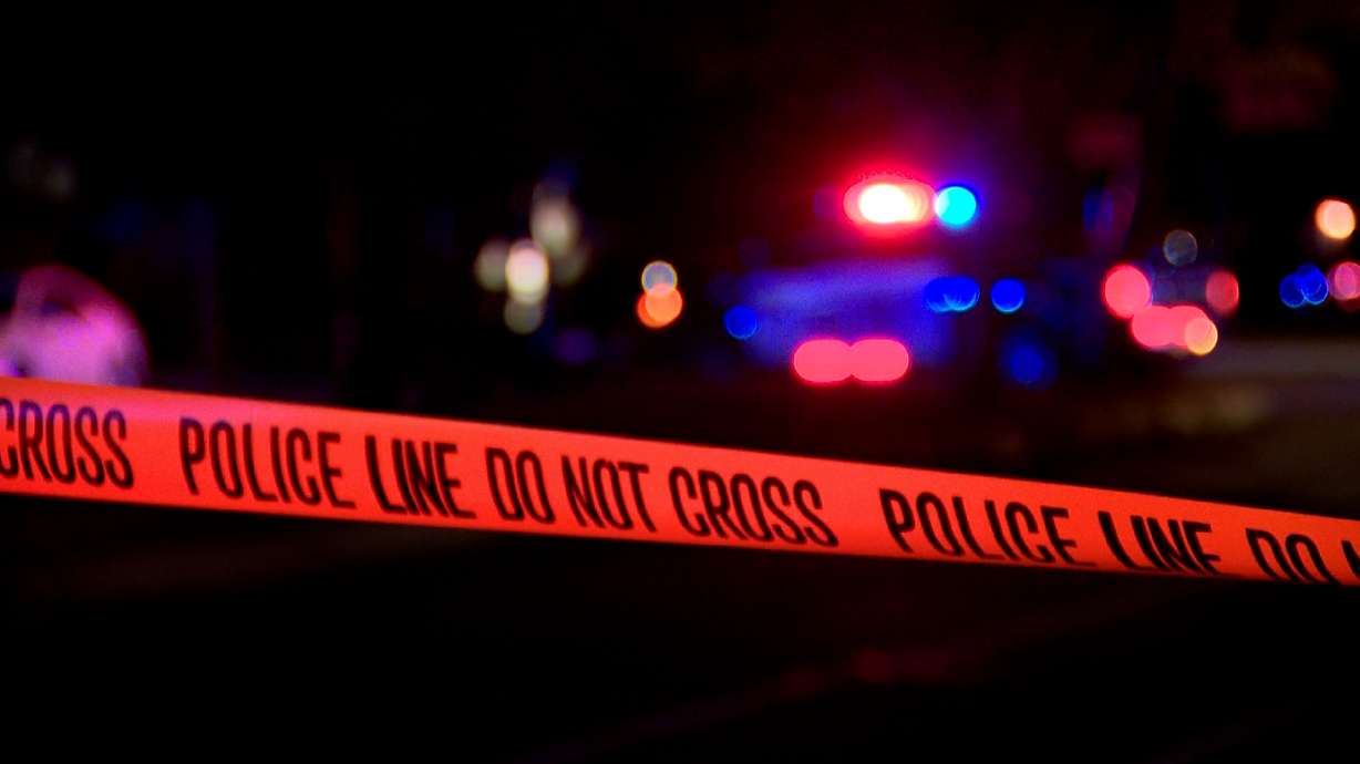 A police line shows a perimeter of a shooting scene near 400 South on Monday night in Salt Lake City, where a man allegedly ran from police and was shot by responding officers. He has since been arrested.