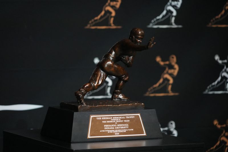 Jan 17, 2026; Miami Beach, Florida, USA; The 2025 Heisman Trophy of Indiana Hoosiers quarterback Fernando Mendoza at Playoff Fan Central at the Miami Beach Convention Center.