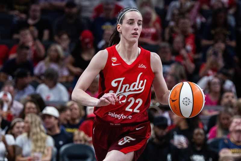 FILE PHOTO: Aug 28, 2026; Indianapolis, Indiana, USA;  Indiana Fever guard Caitlin Clark (22) dribbles the ball in the second half against the Connecticut Sun at Gainbridge Fieldhouse.