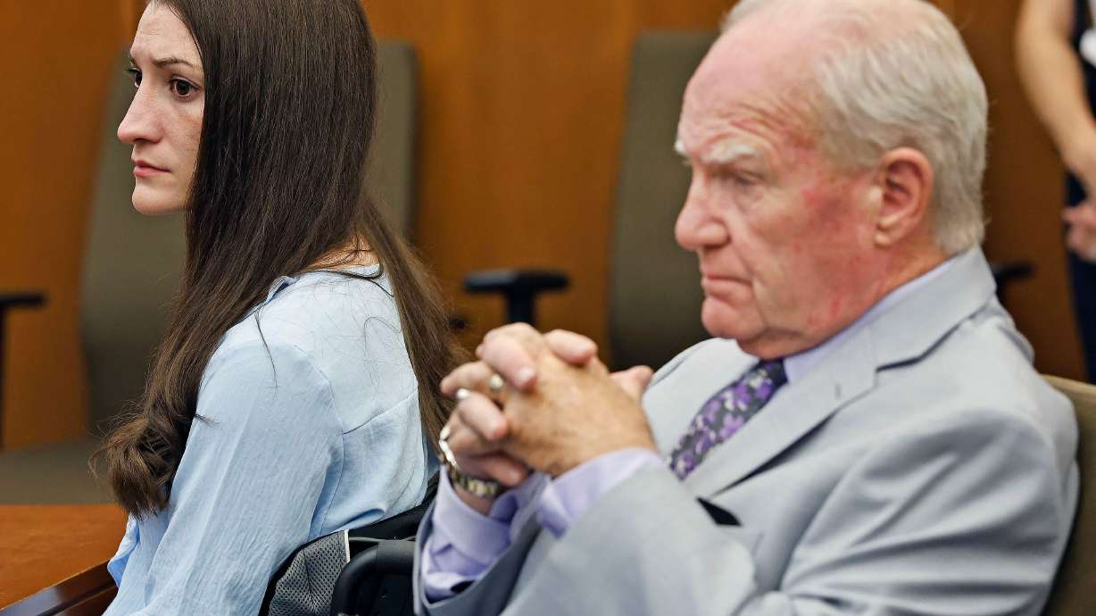 Lindsay Clancy and attorney Kevin Reddington watch jurors as Judge William Sullivan asks them to continue deliberations. The jury has come back for the second time to say they could not reach a unanimous verdict.