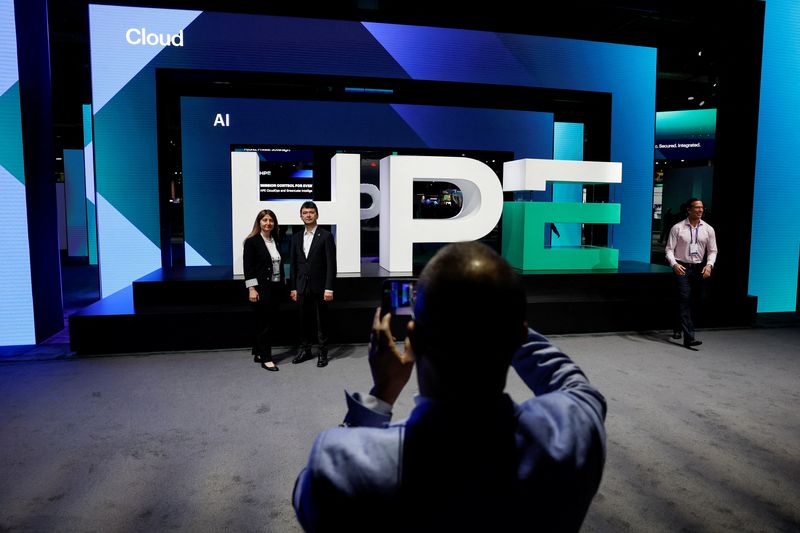 Attendees take photos in front of the HPE logo, at HPE Discover Las Vegas 2026, in Las Vegas, Nevada, U.S., June 16, 2026.